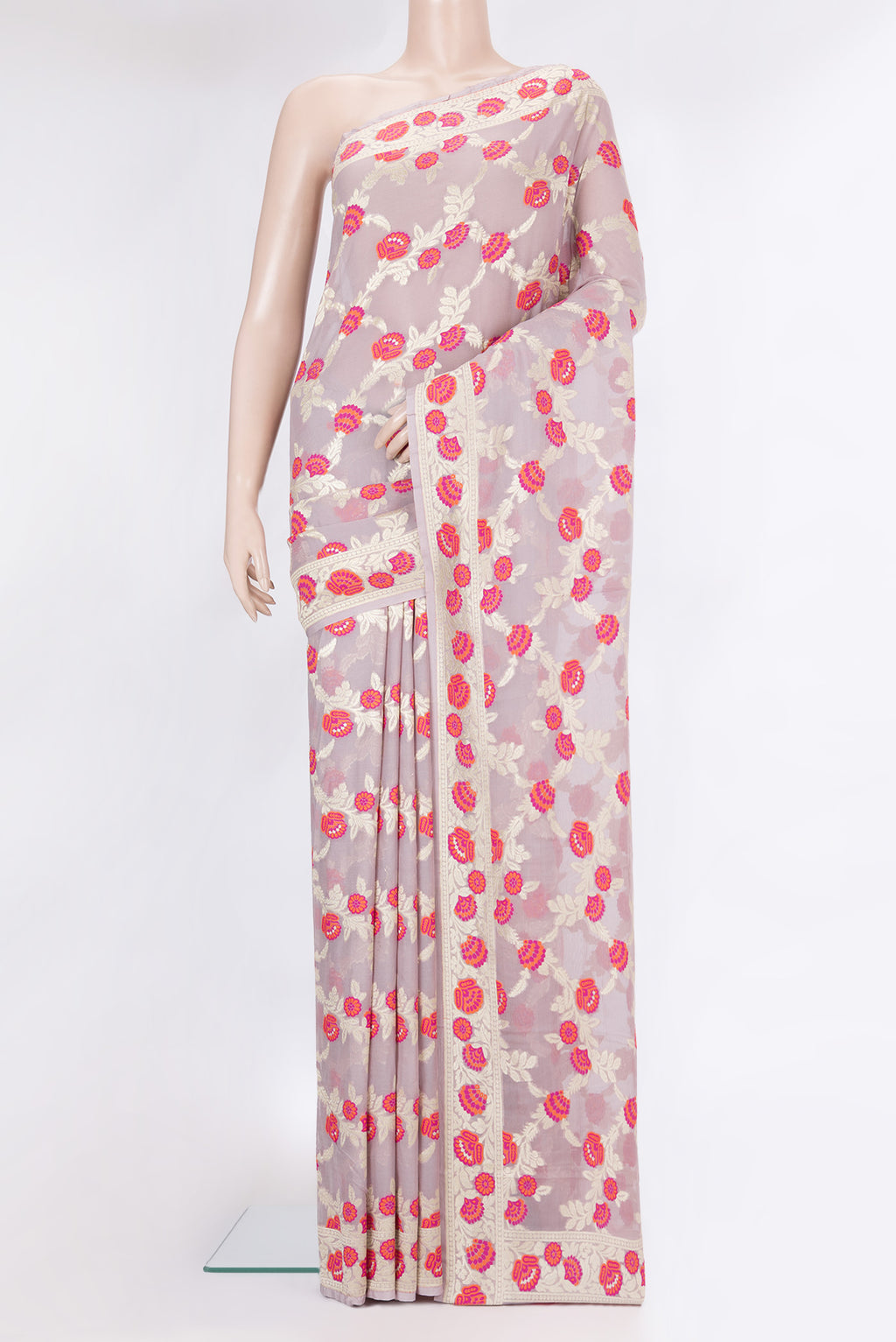 Lavender Banarasi Georgette Saree with Zari And Thread Butta on the body and Fancy Border.  displayed on a mannequin