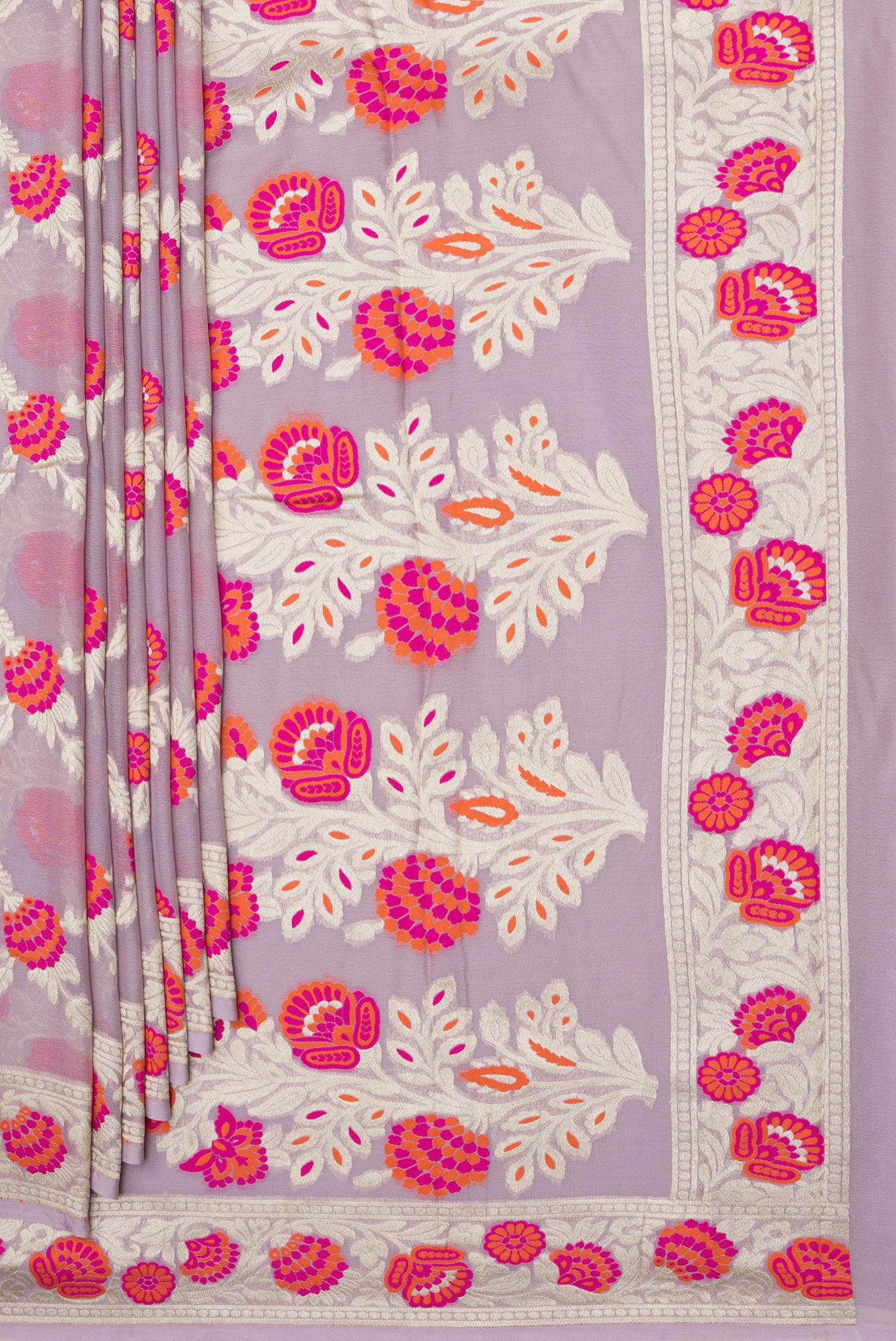 Pleats and pallu of Lavender Banarasi Georgette Saree with Zari And Thread Butta on the body and Fancy Border. 