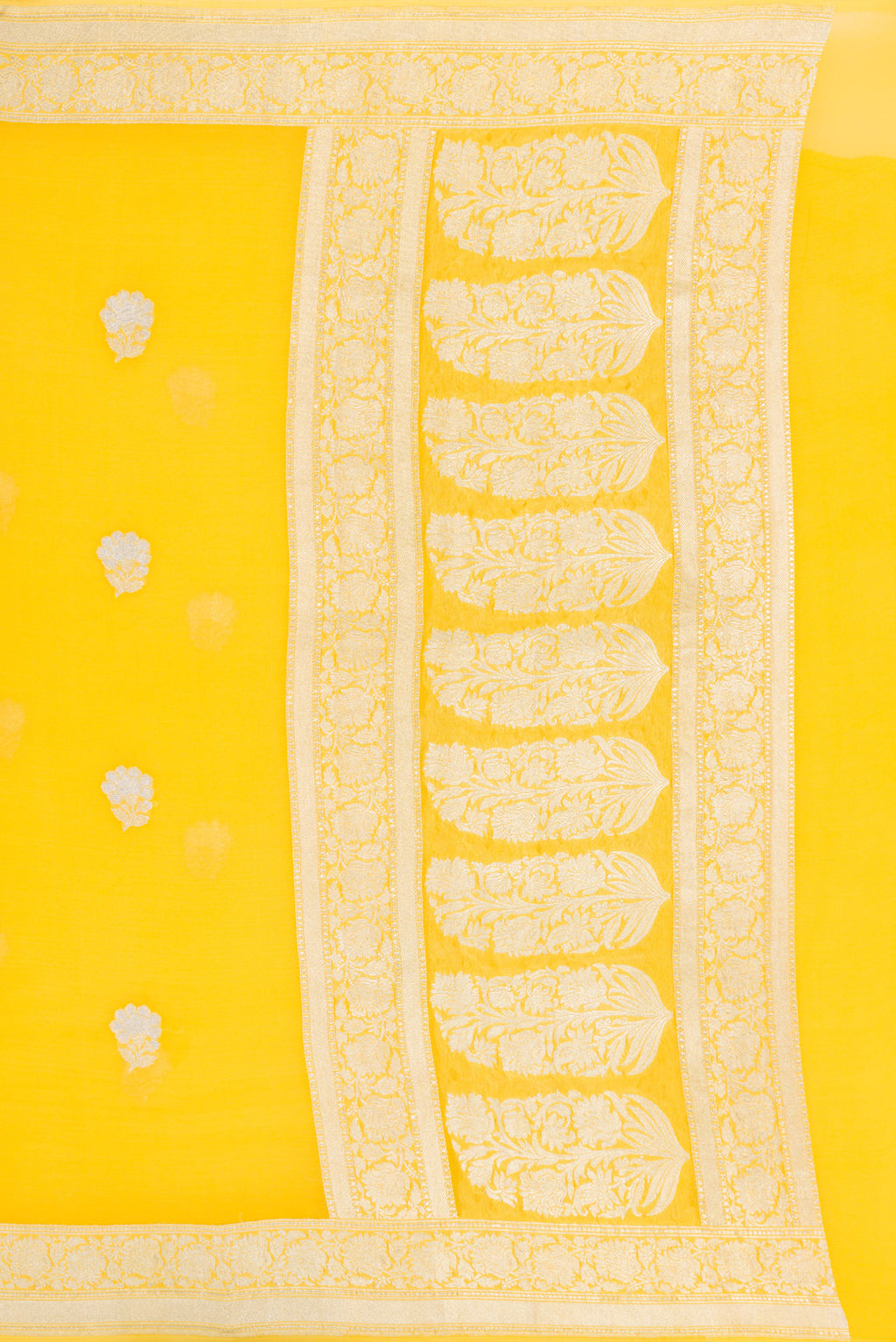 Close up image of the pallu of Yellow Banarasi Georgette Saree with Zari Butta on the body and Zari Border. 