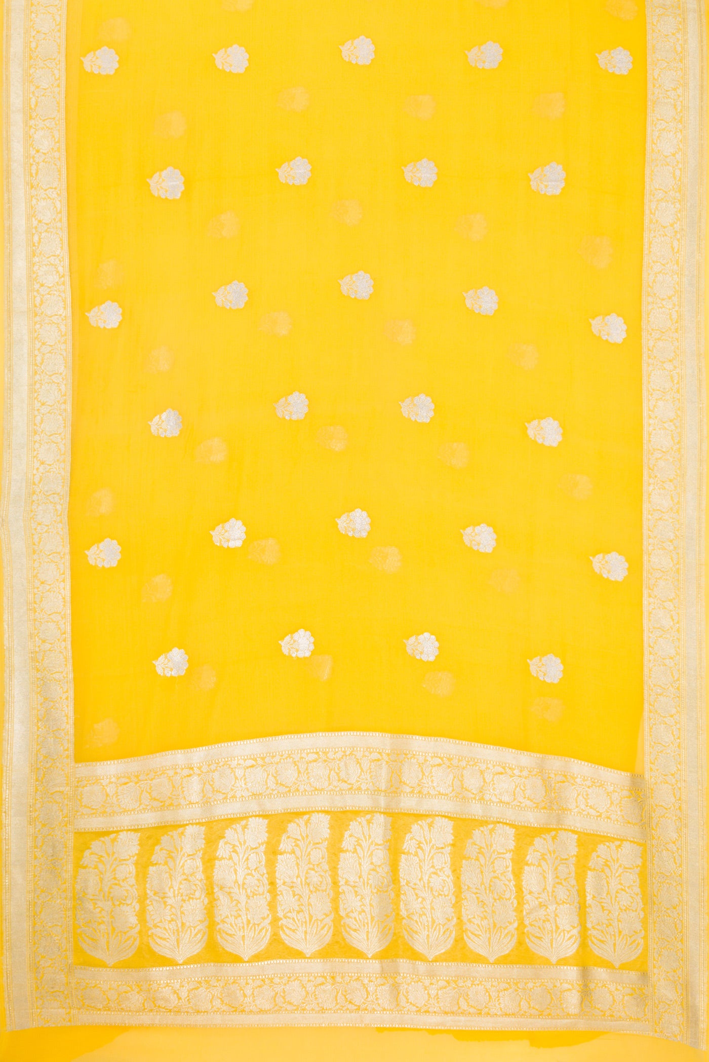 Flat view of Yellow Banarasi Georgette Saree with Zari Butta on the body and Zari Border. 
