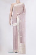 Rose Gold Banarasi Georgette Saree with Zari Butta on the body and Zari Border.  displayed on a mannequin