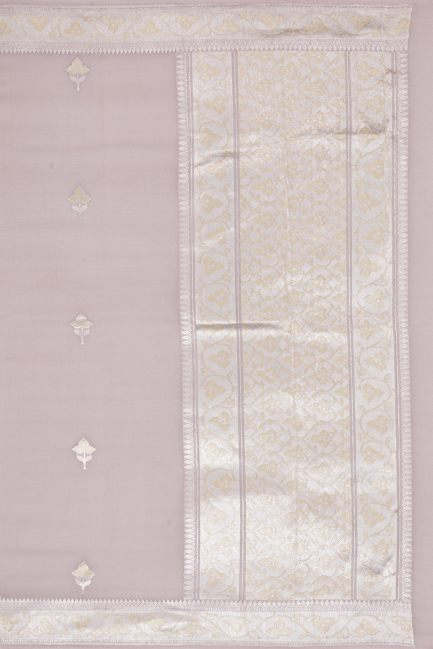 Close up image of the pallu of Rose Gold Banarasi Georgette Saree with Zari Butta on the body and Zari Border. 