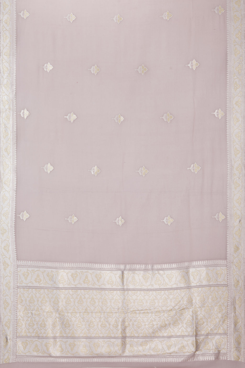 Flat view of Rose Gold Banarasi Georgette Saree with Zari Butta on the body and Zari Border. 