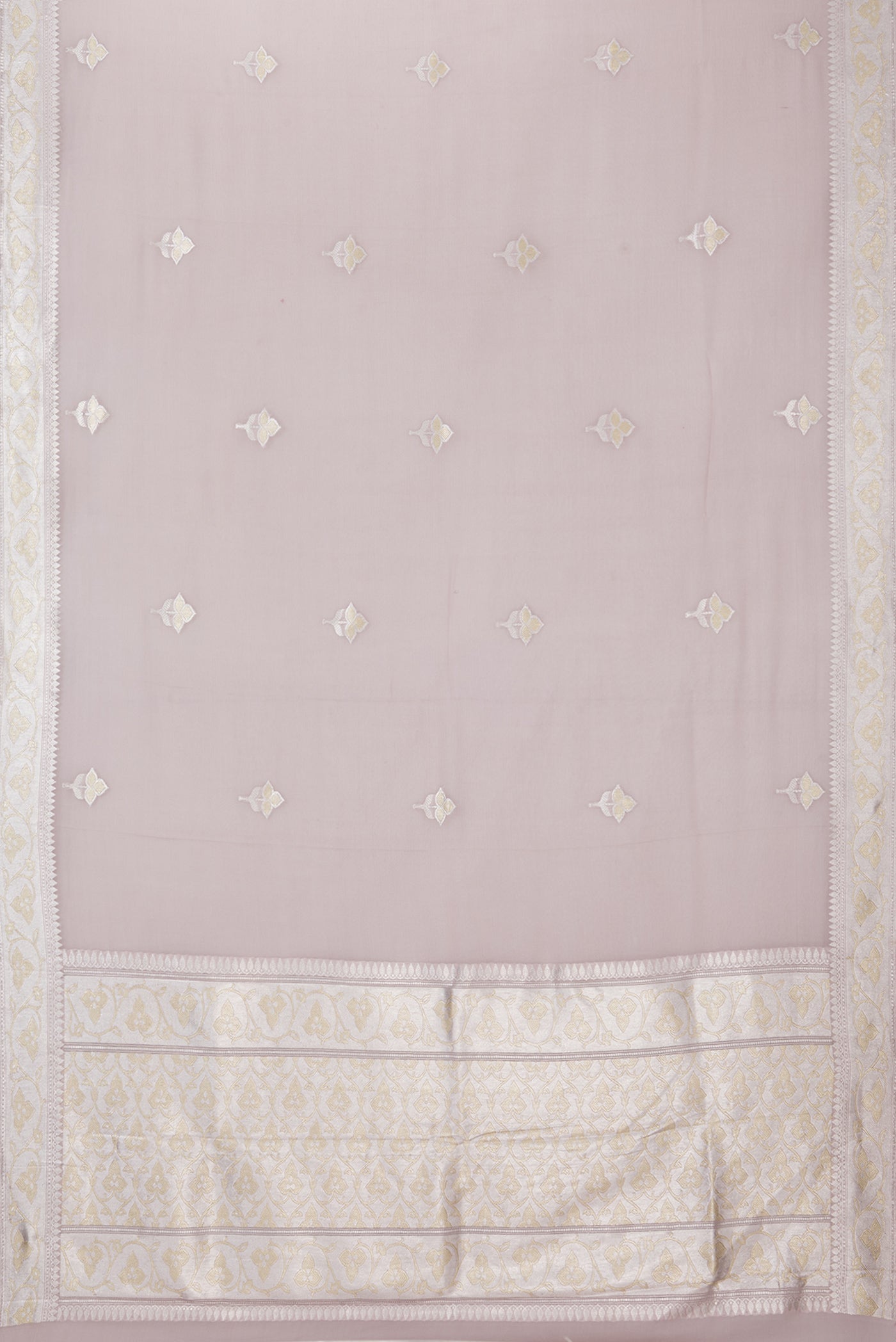 Flat view of Rose Gold Banarasi Georgette Saree with Zari Butta on the body and Zari Border. 