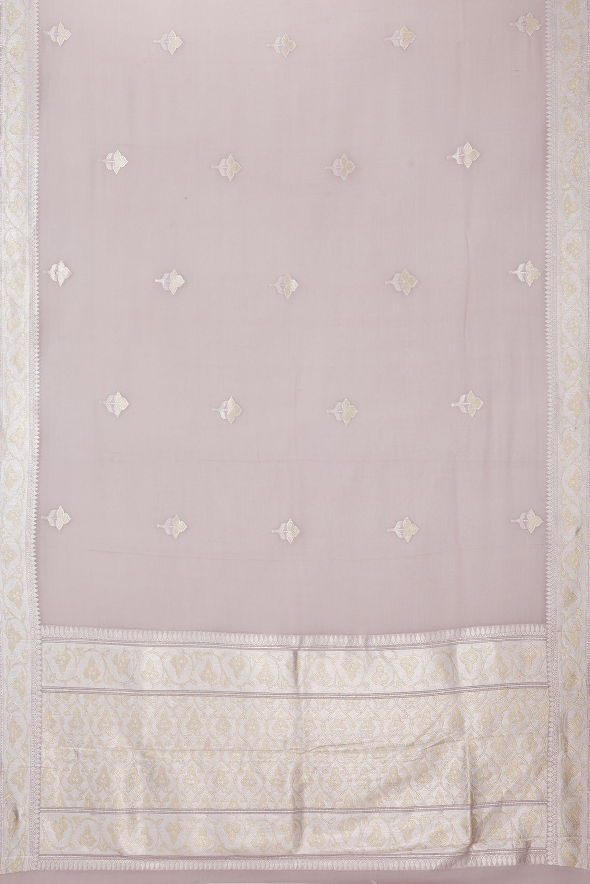 Flat view of Rose Gold Banarasi Georgette Saree with Zari Butta on the body and Zari Border. 