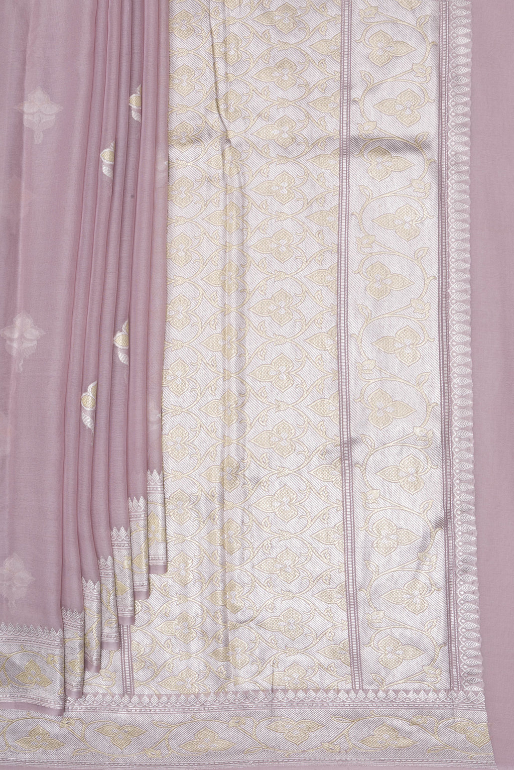 Pleats and pallu of Rose Gold Banarasi Georgette Saree with Zari Butta on the body and Zari Border. 