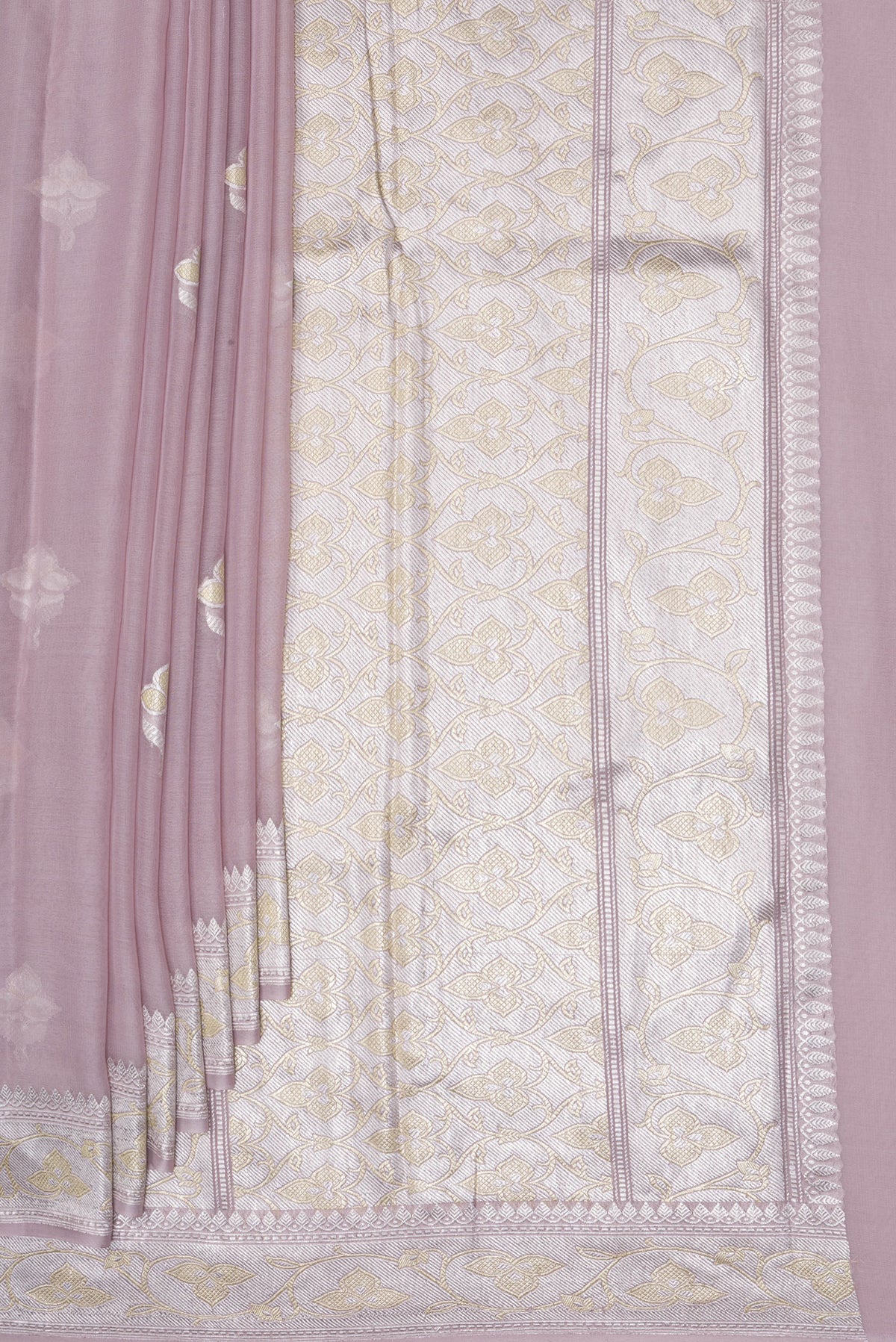 Pleats and pallu of Rose Gold Banarasi Georgette Saree with Zari Butta on the body and Zari Border. 