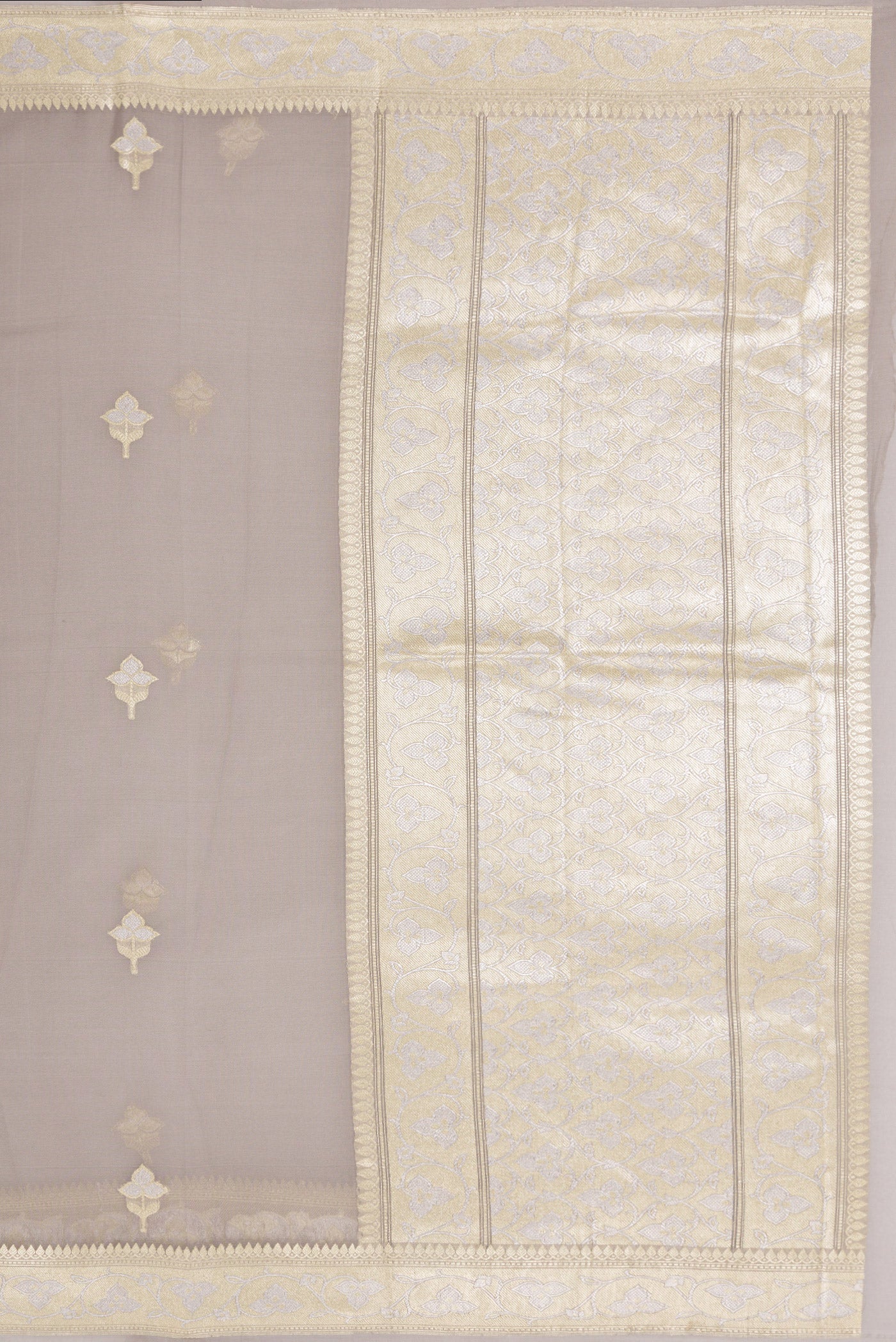 Close up image of the pallu of Grey Banarasi Georgette Saree with Zari Butta on the body and Zari Border. 