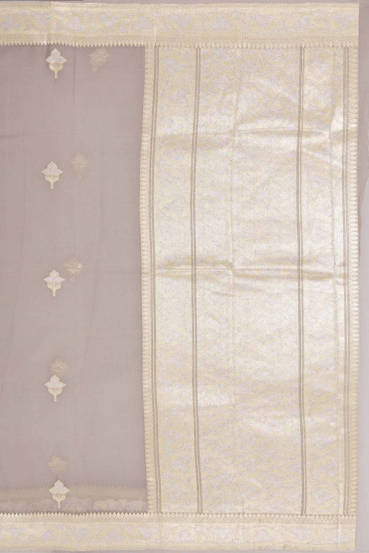 Close up image of the pallu of Grey Banarasi Georgette Saree with Zari Butta on the body and Zari Border. 