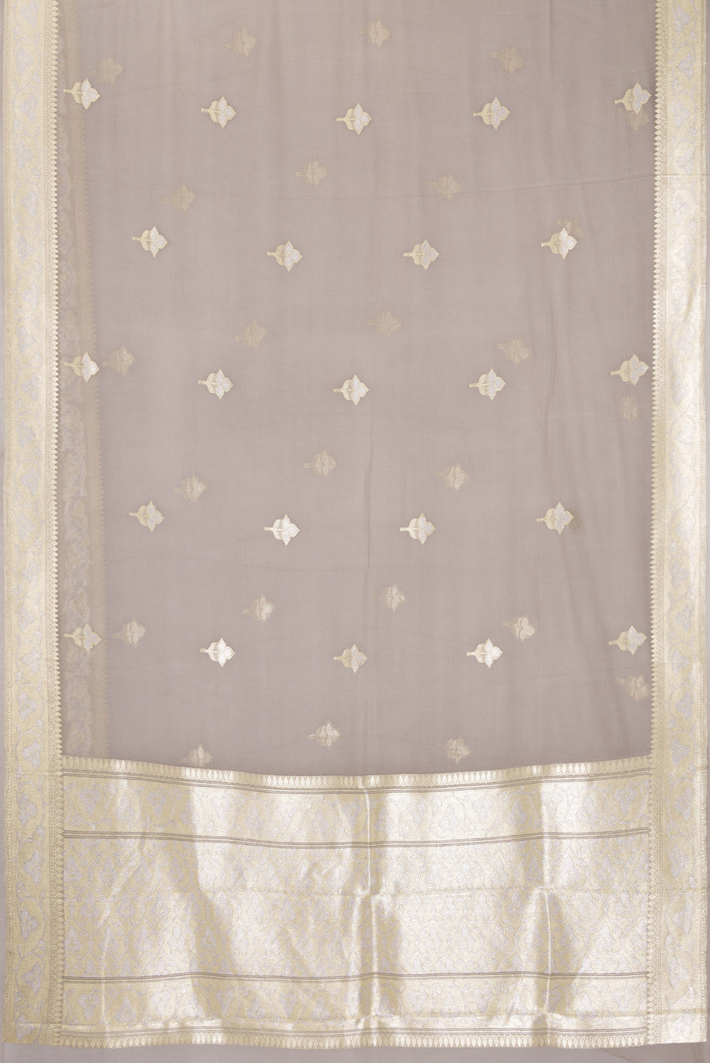 Flat view of Grey Banarasi Georgette Saree with Zari Butta on the body and Zari Border. 