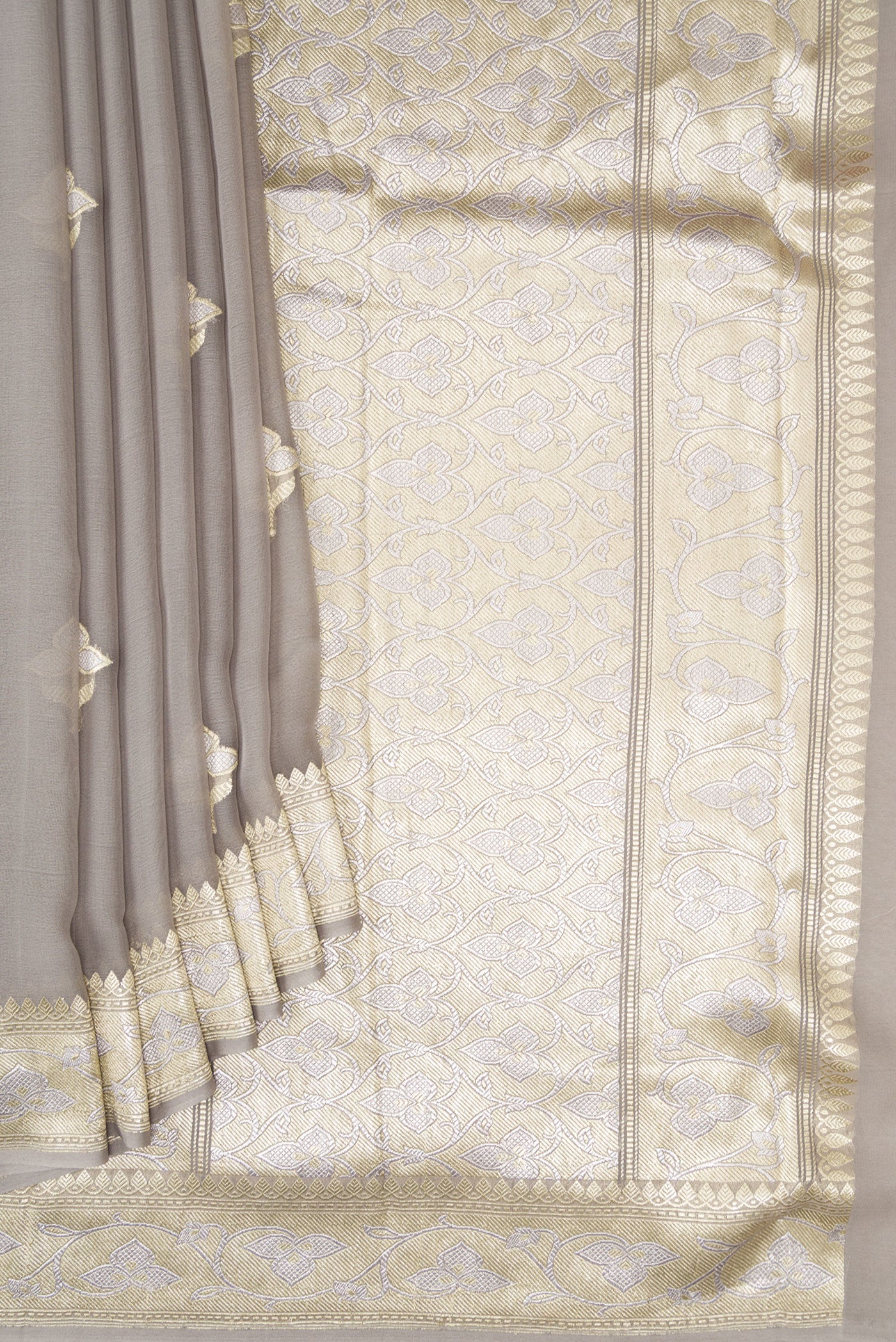 Pleats and pallu of Grey Banarasi Georgette Saree with Zari Butta on the body and Zari Border. 