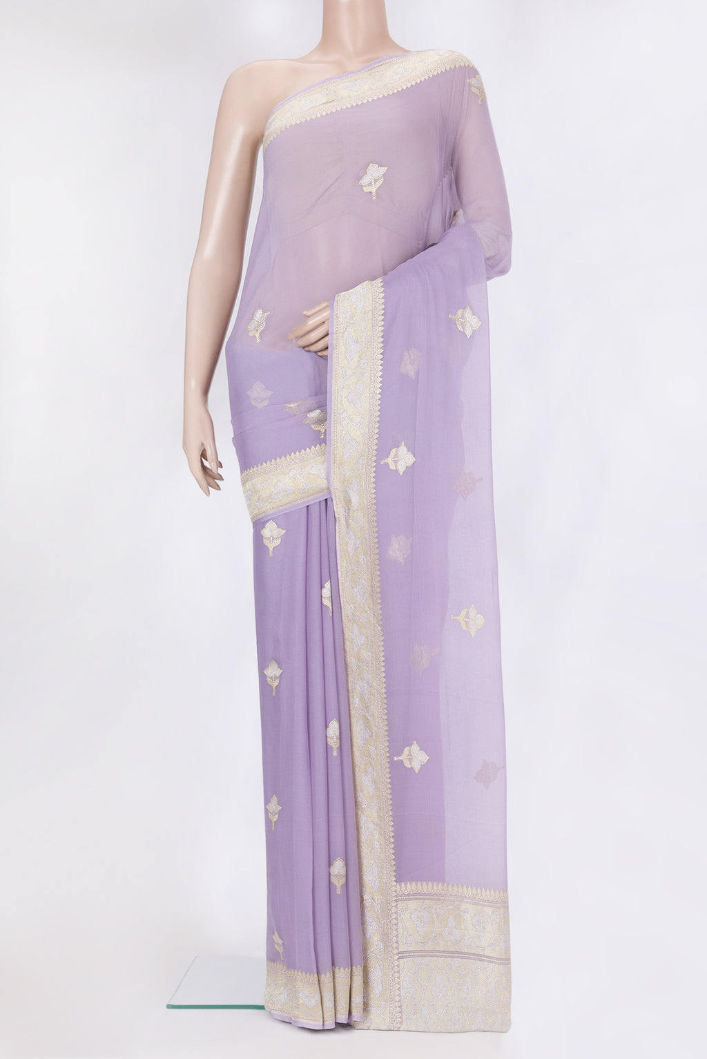 Lavender Banarasi Georgette Saree with Zari Butta on the body and Fancy Border.  displayed on a mannequin