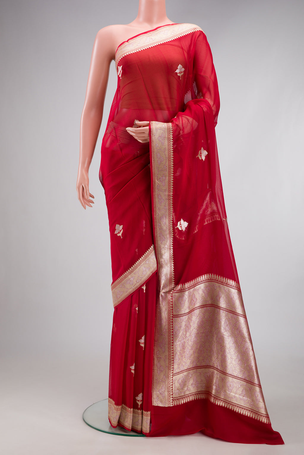 Red Banarasi Georgette Saree with Zari Butta on the body and Zari Border.  displayed on a mannequin