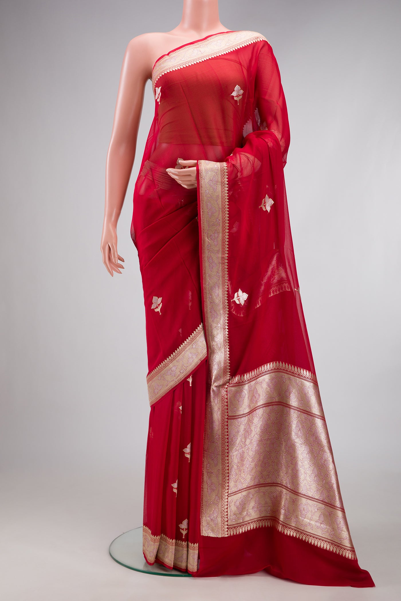 Red Banarasi Georgette Saree with Zari Butta on the body and Zari Border.  displayed on a mannequin