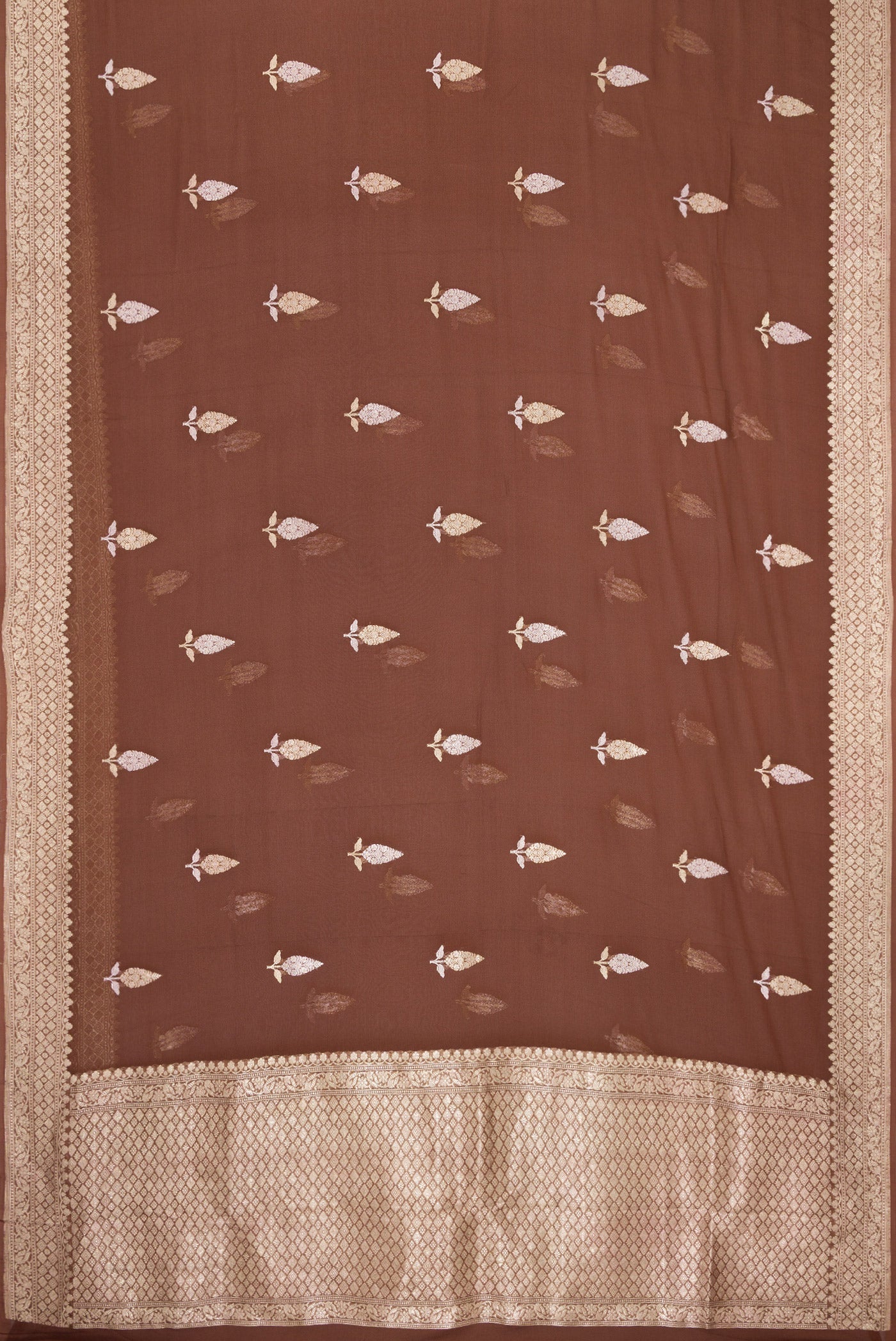 Flat view of Brown Banarasi Georgette Saree with Zari Butta on the body and Fancy Border. 
