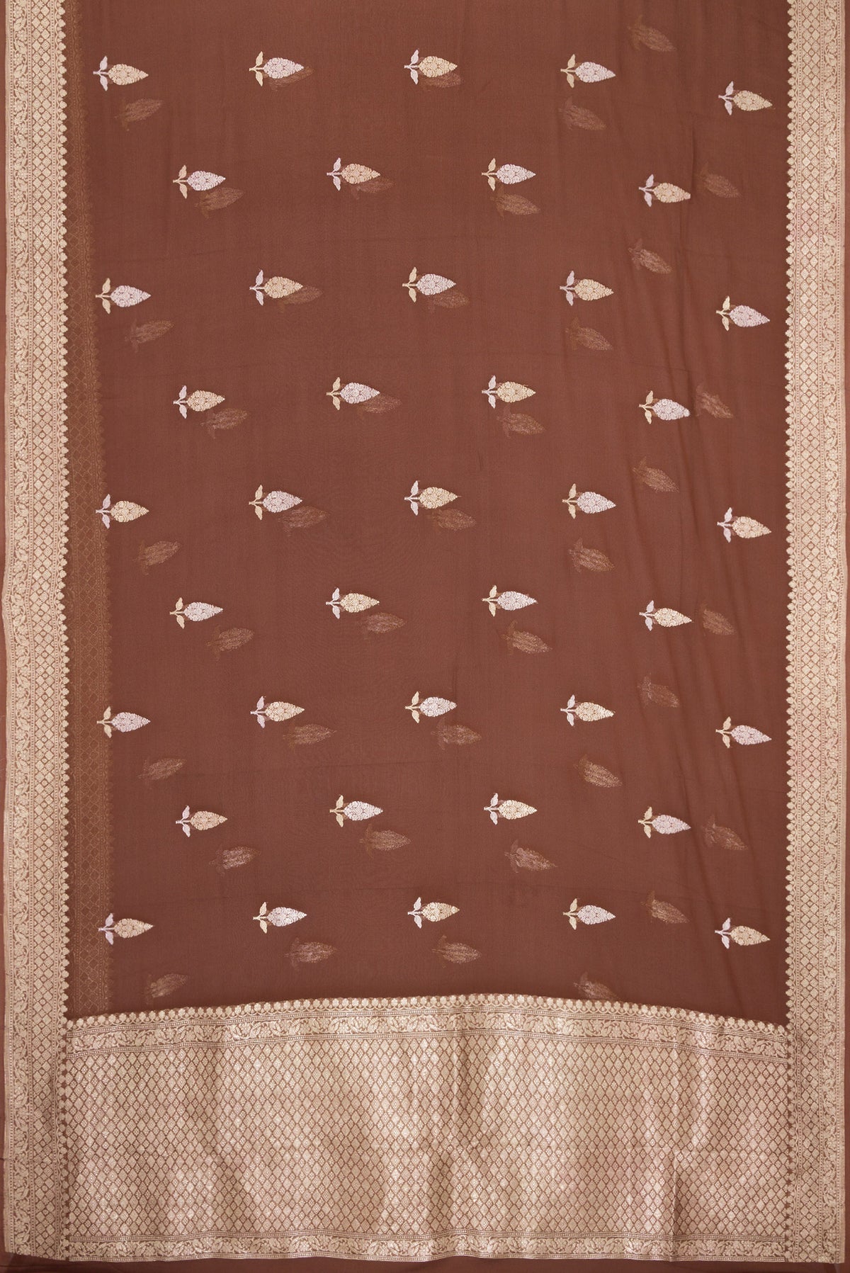 Flat view of Brown Banarasi Georgette Saree with Zari Butta on the body and Fancy Border. 