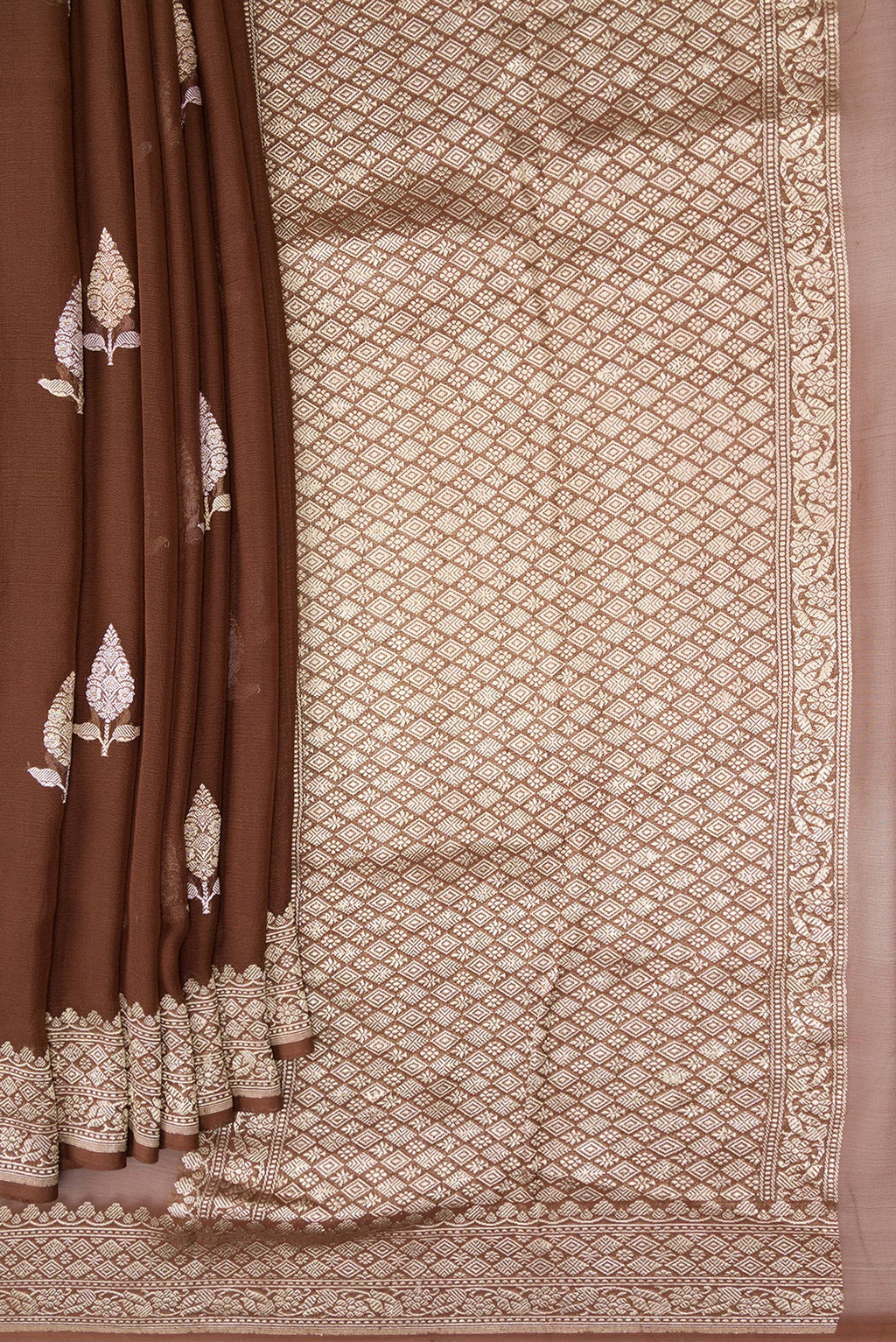 Pleats and pallu of Brown Banarasi Georgette Saree with Zari Butta on the body and Fancy Border. 