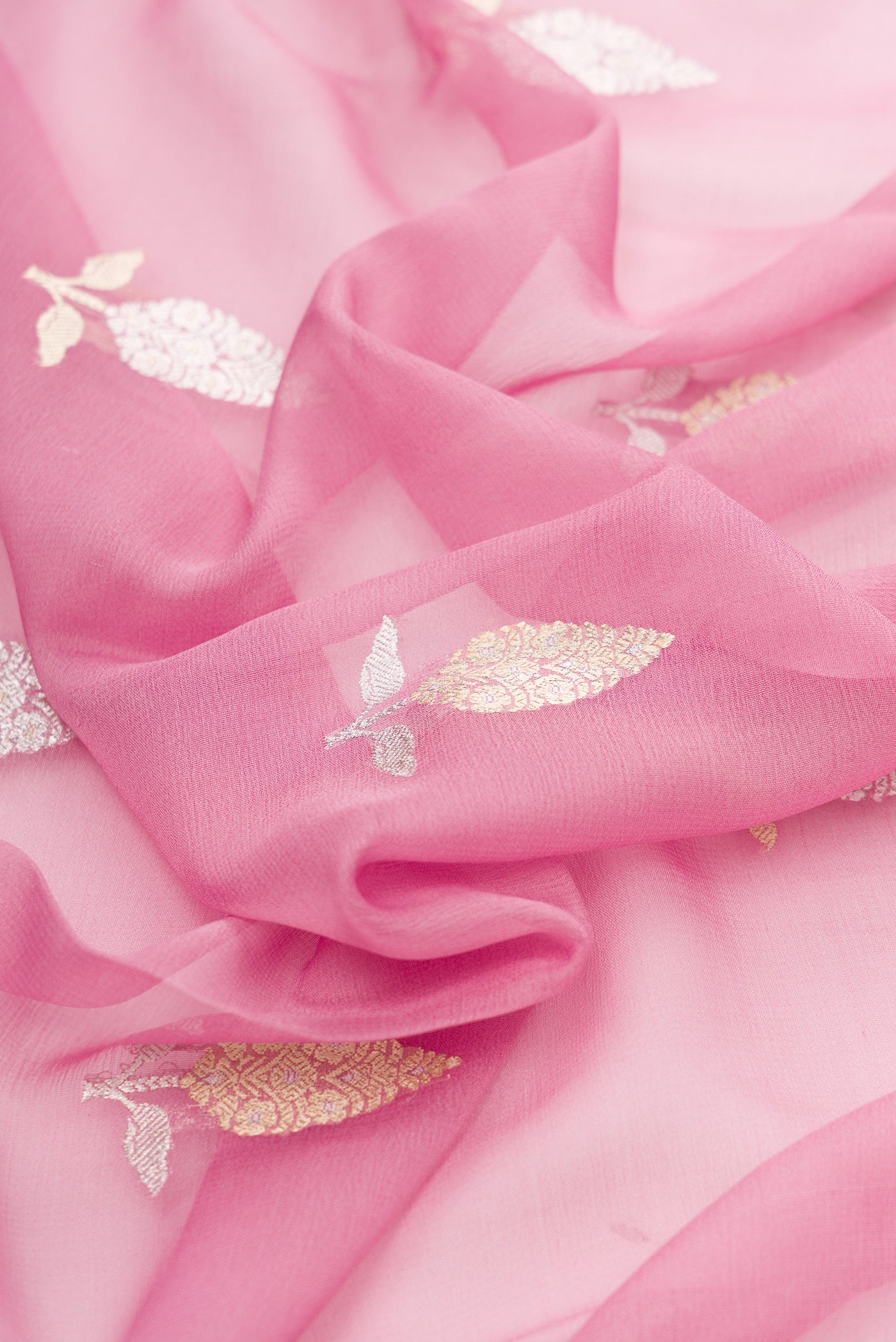 Close up of Pink Dual Tone Banarasi Georgette Saree with Embroidery on the body and Embroidery Border.  displaying folds
