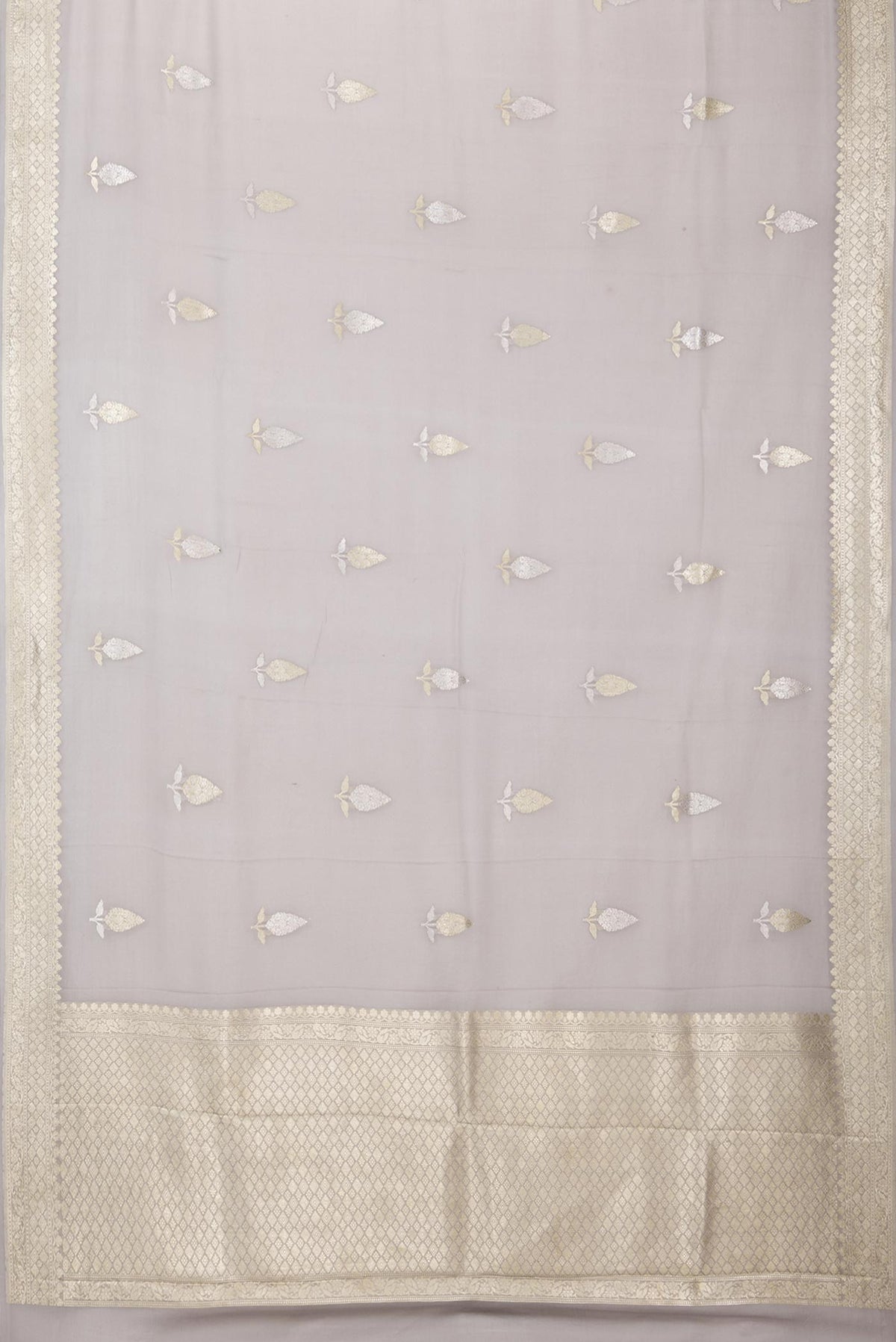 Flat view of Grey Banarasi Georgette Saree with Zari Butta on the body and Zari Border. 