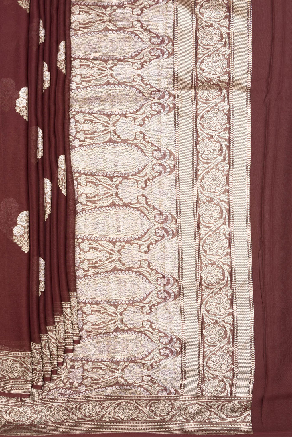 Pleats and pallu of Brown Banarasi Georgette Saree with Zari Butta on the body and Zari Border. 