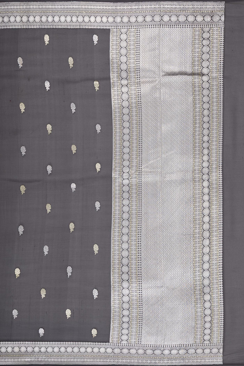 Close up image of the pallu of Black Banarasi Georgette Saree with Zari Butta on the body and Zari Border. 