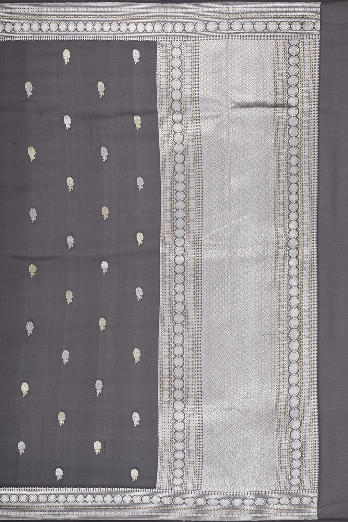 Close up image of the pallu of Black Banarasi Georgette Saree with Zari Butta on the body and Zari Border. 