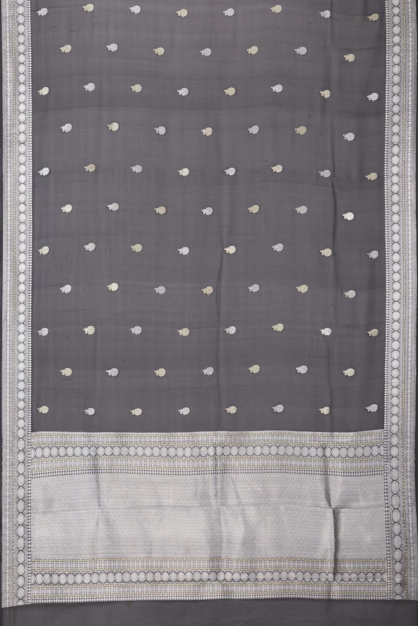 Flat view of Black Banarasi Georgette Saree with Zari Butta on the body and Zari Border. 