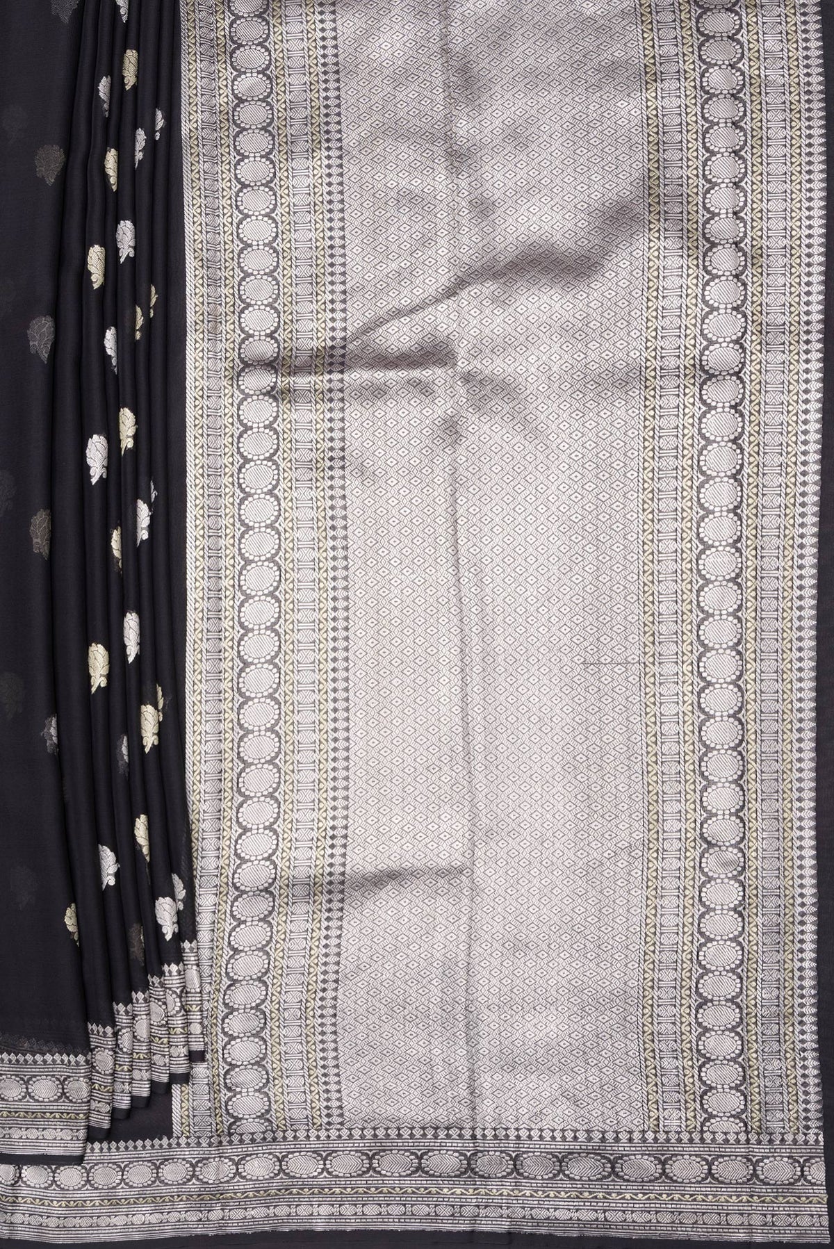 Pleats and pallu of Black Banarasi Georgette Saree with Zari Butta on the body and Zari Border. 