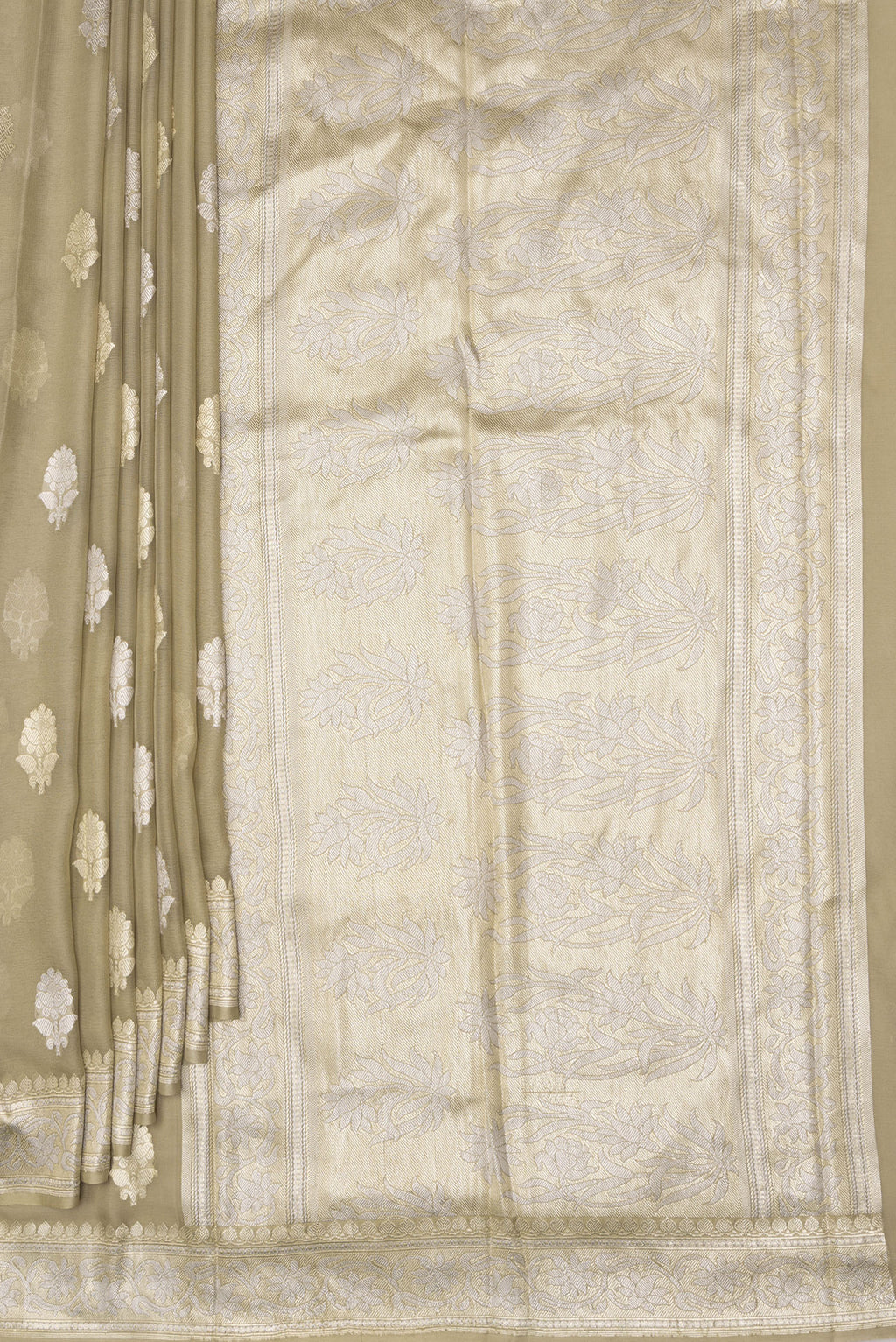 Pleats and pallu of Beige Banarasi Georgette Saree with Zari Butta on the body and Zari Border. 