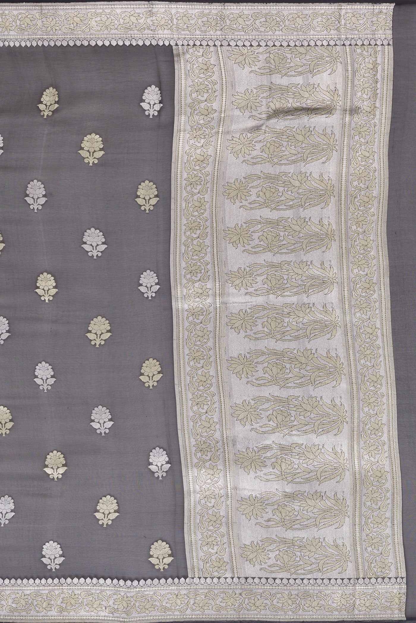 Close up image of the pallu of Black Banarasi Georgette Saree with Zari Butta on the body and Zari Border. 