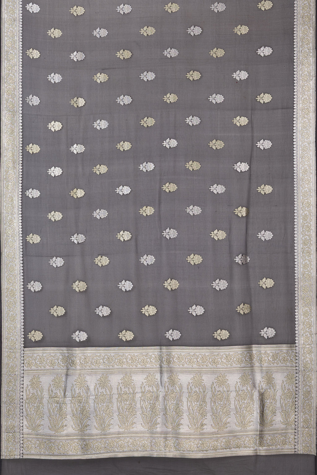 Flat view of Black Banarasi Georgette Saree with Zari Butta on the body and Zari Border. 