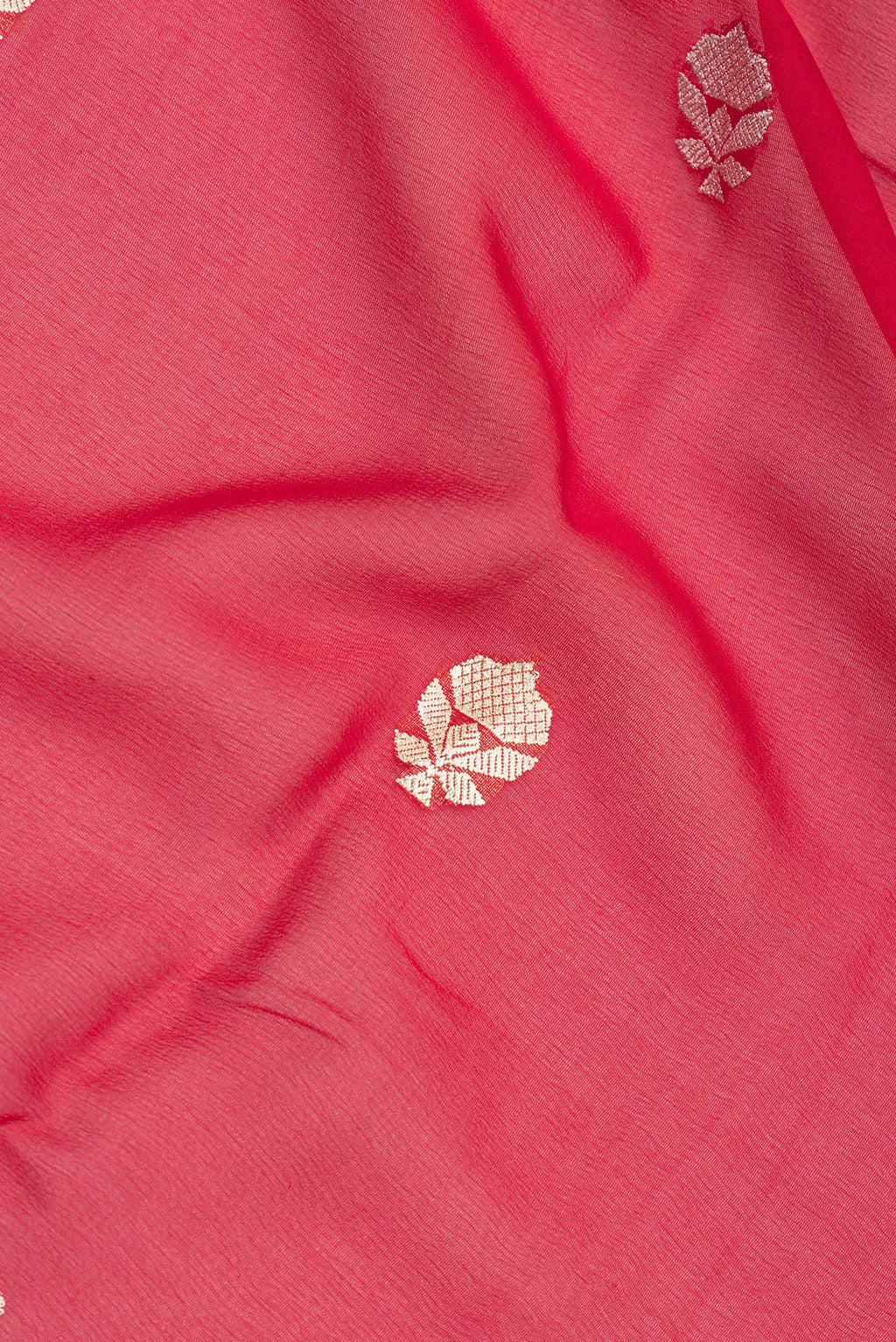 Close up of Red Banarasi Georgette Saree with Zari Butta on the body and Zari Border.  displaying folds