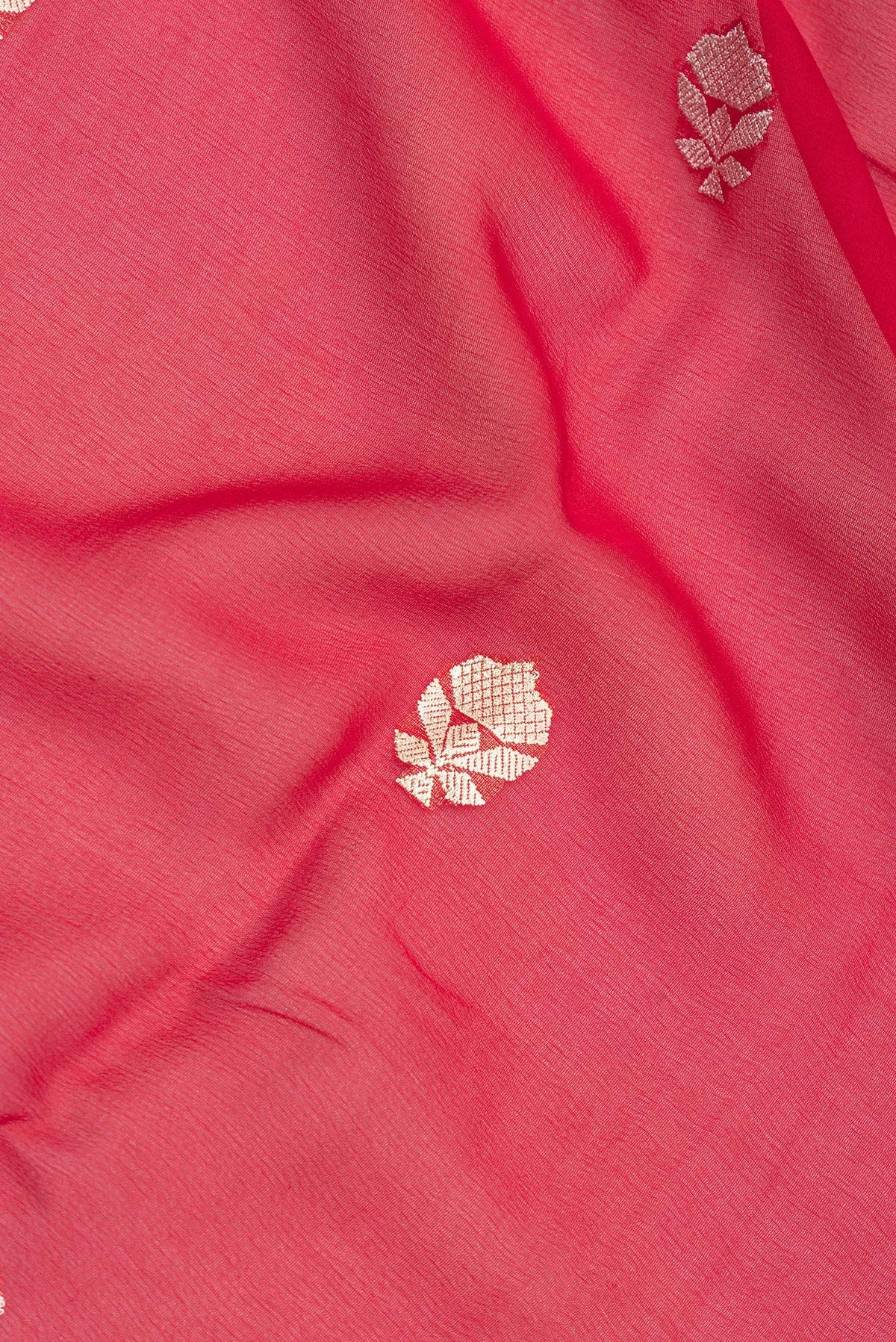 Close up of Red Banarasi Georgette Saree with Zari Butta on the body and Zari Border.  displaying folds
