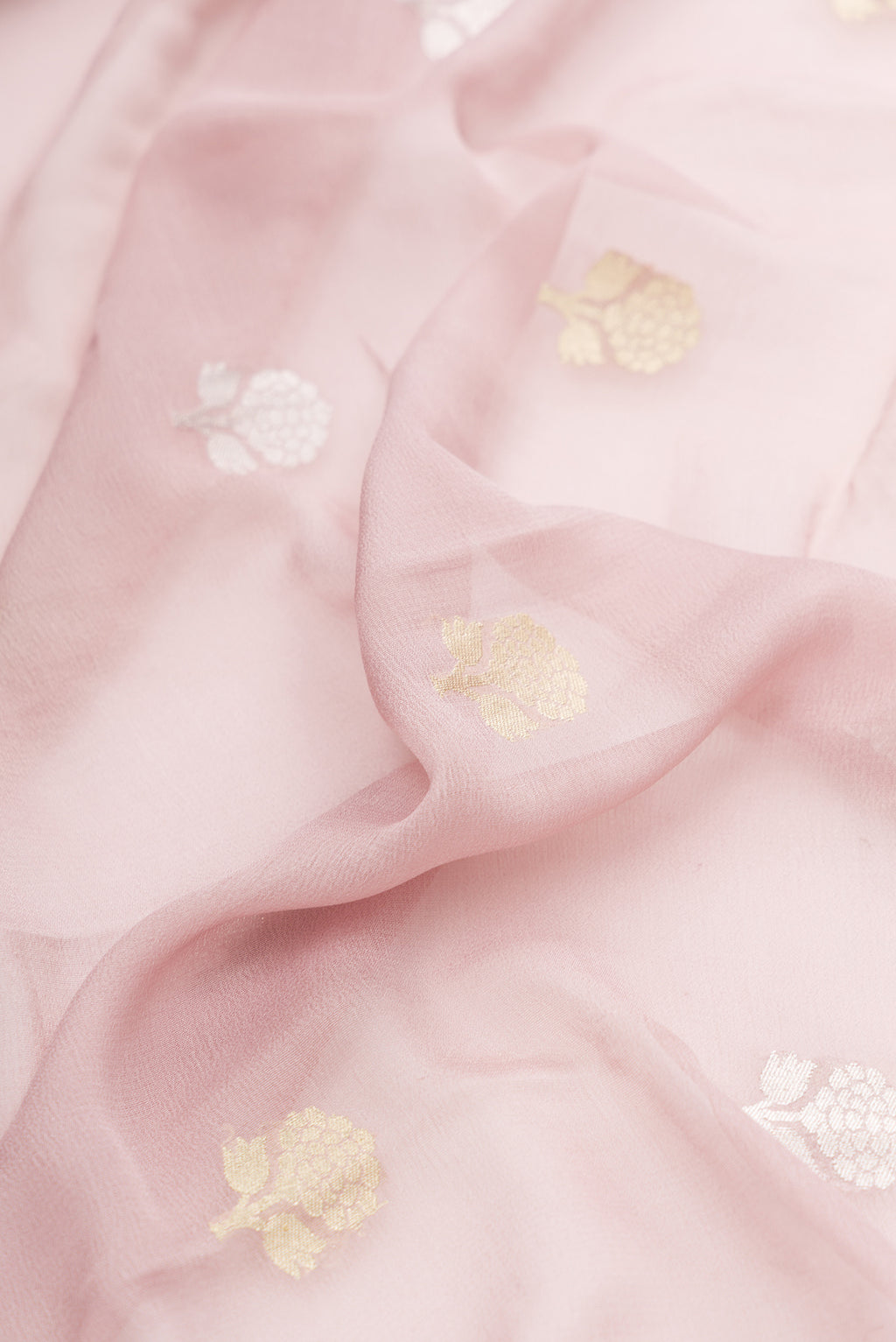 Close up of Lilac Banarasi Georgette Saree with Zari Butta on the body and Fancy Border.  displaying folds