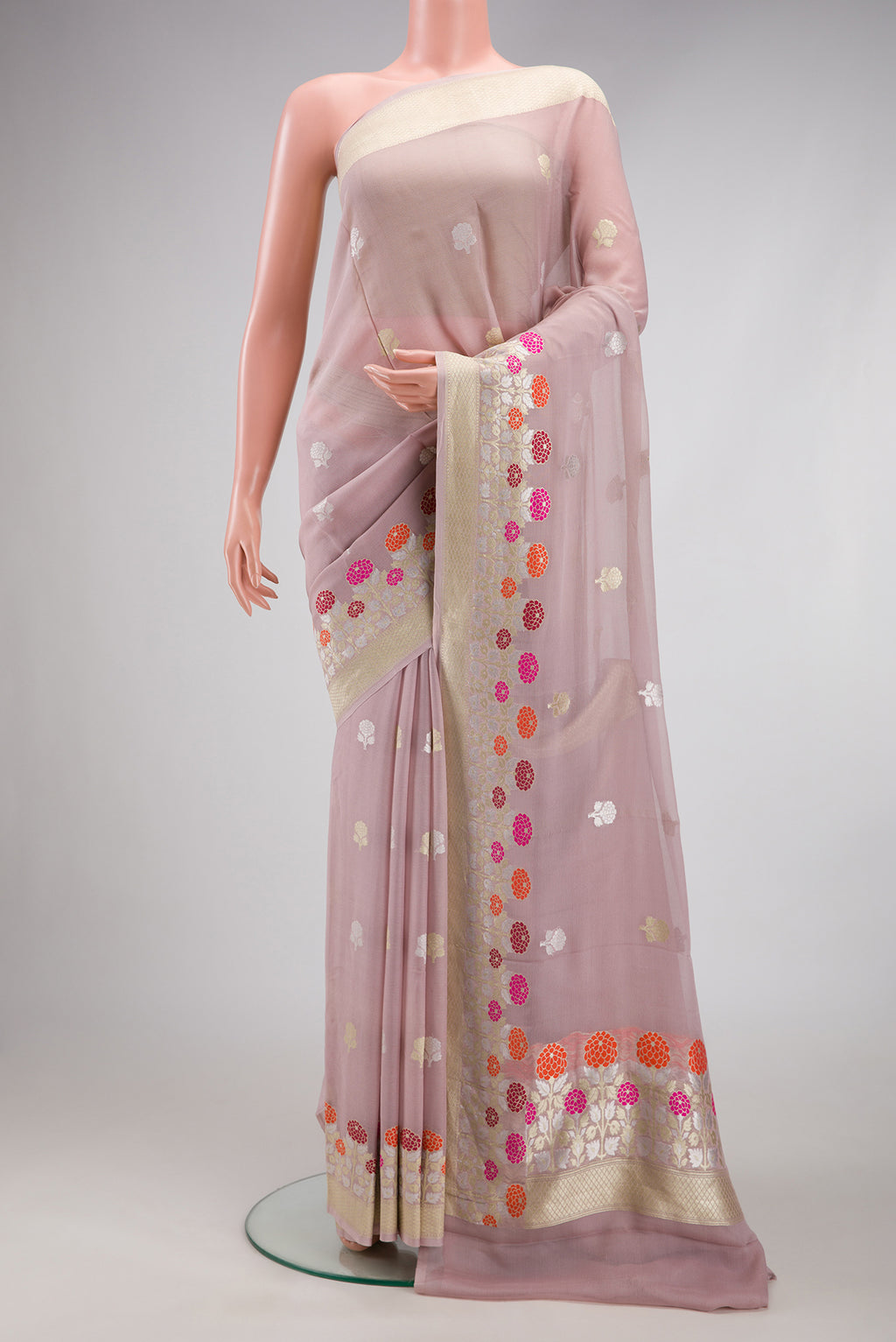 Lilac Banarasi Georgette Saree with Zari Butta on the body and Fancy Border.  displayed on a mannequin