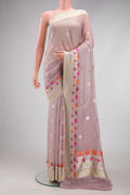 Lilac Banarasi Georgette Saree with Zari Butta on the body and Fancy Border.  displayed on a mannequin