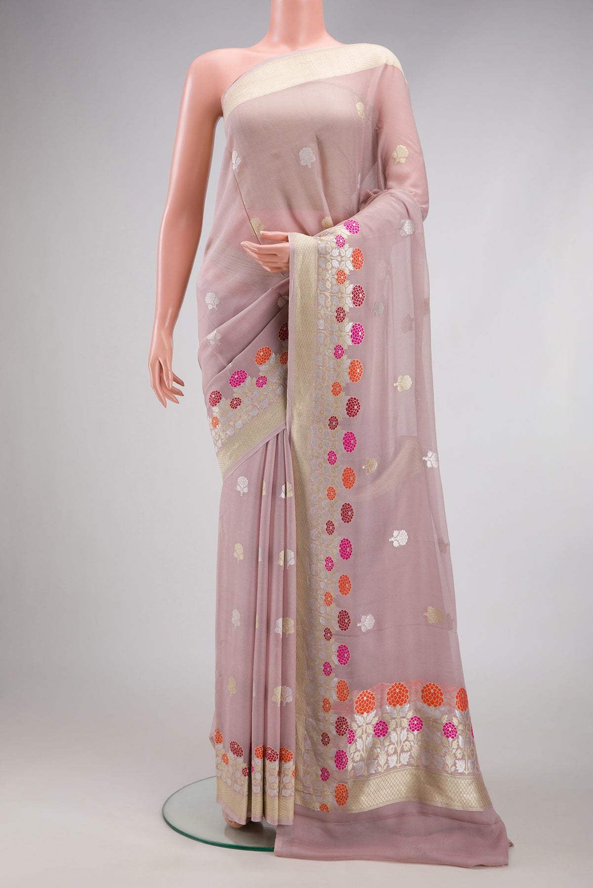 Lilac Banarasi Georgette Saree with Zari Butta on the body and Fancy Border.  displayed on a mannequin