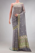 Grey Banarasi Georgette Saree with Zari Butta on the body and Fancy Border.  displayed on a mannequin