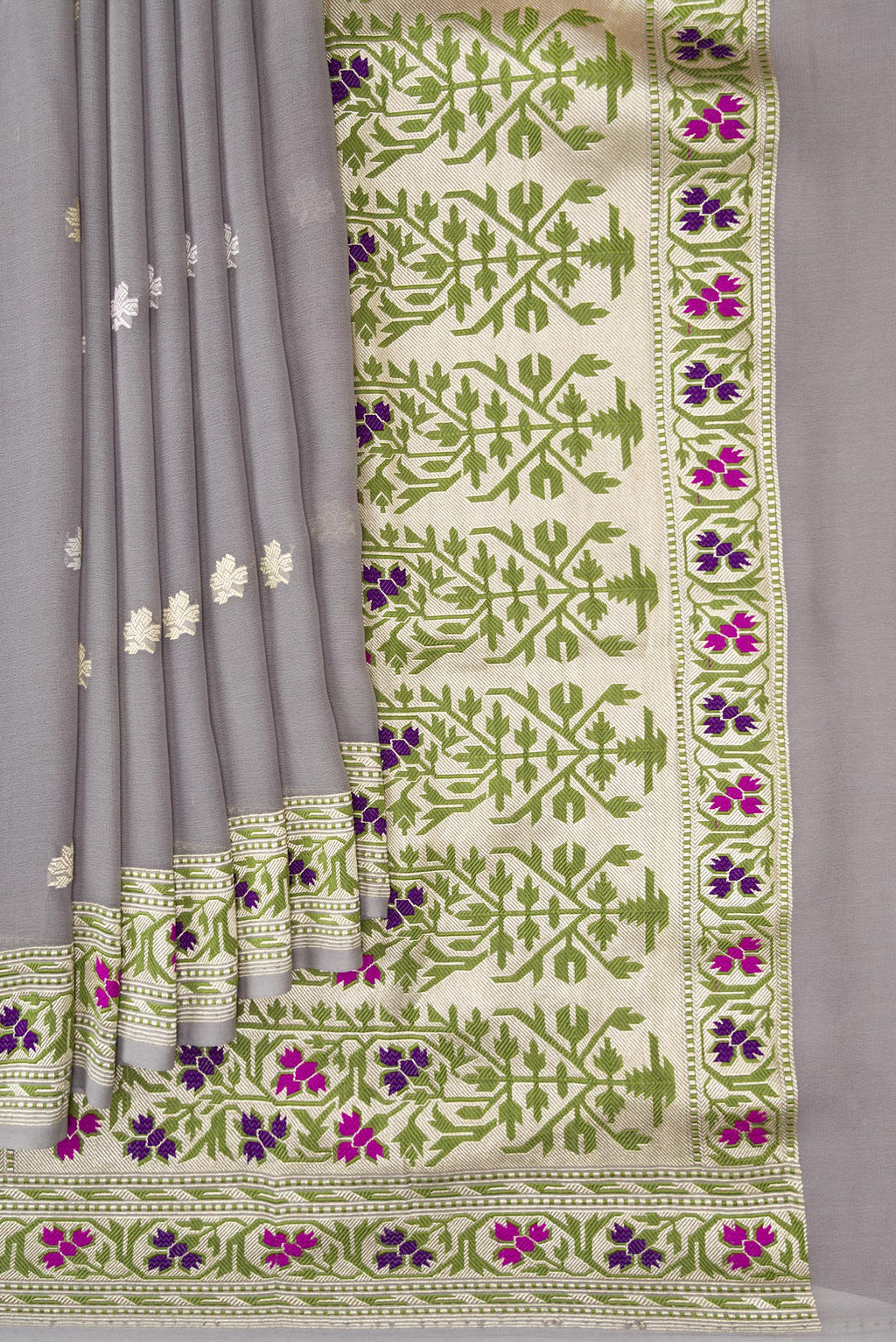Pleats and pallu of Grey Banarasi Georgette Saree with Zari Butta on the body and Fancy Border. 