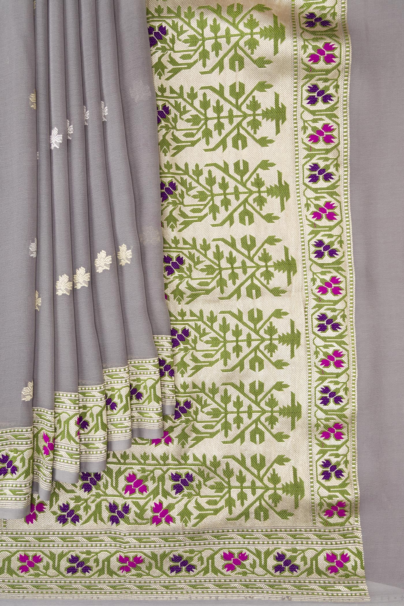 Pleats and pallu of Grey Banarasi Georgette Saree with Zari Butta on the body and Fancy Border. 