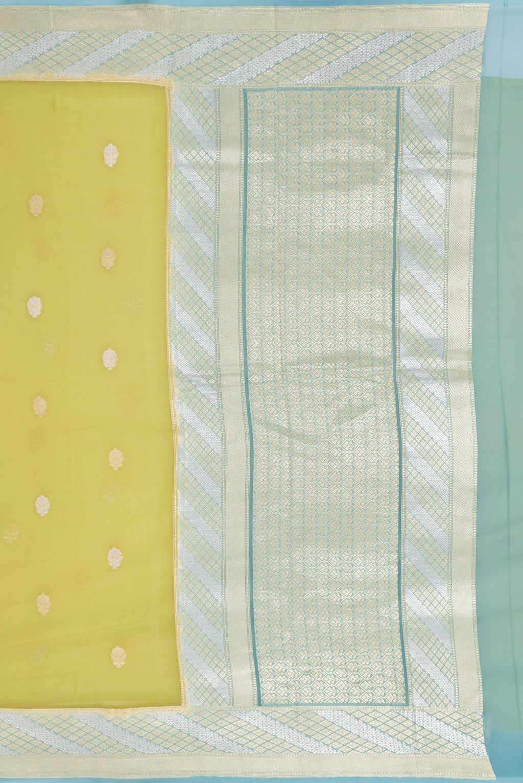 Close up image of the pallu of Pista Green Banarasi Georgette Saree with Zari Butta on the body and Fancy Border. 