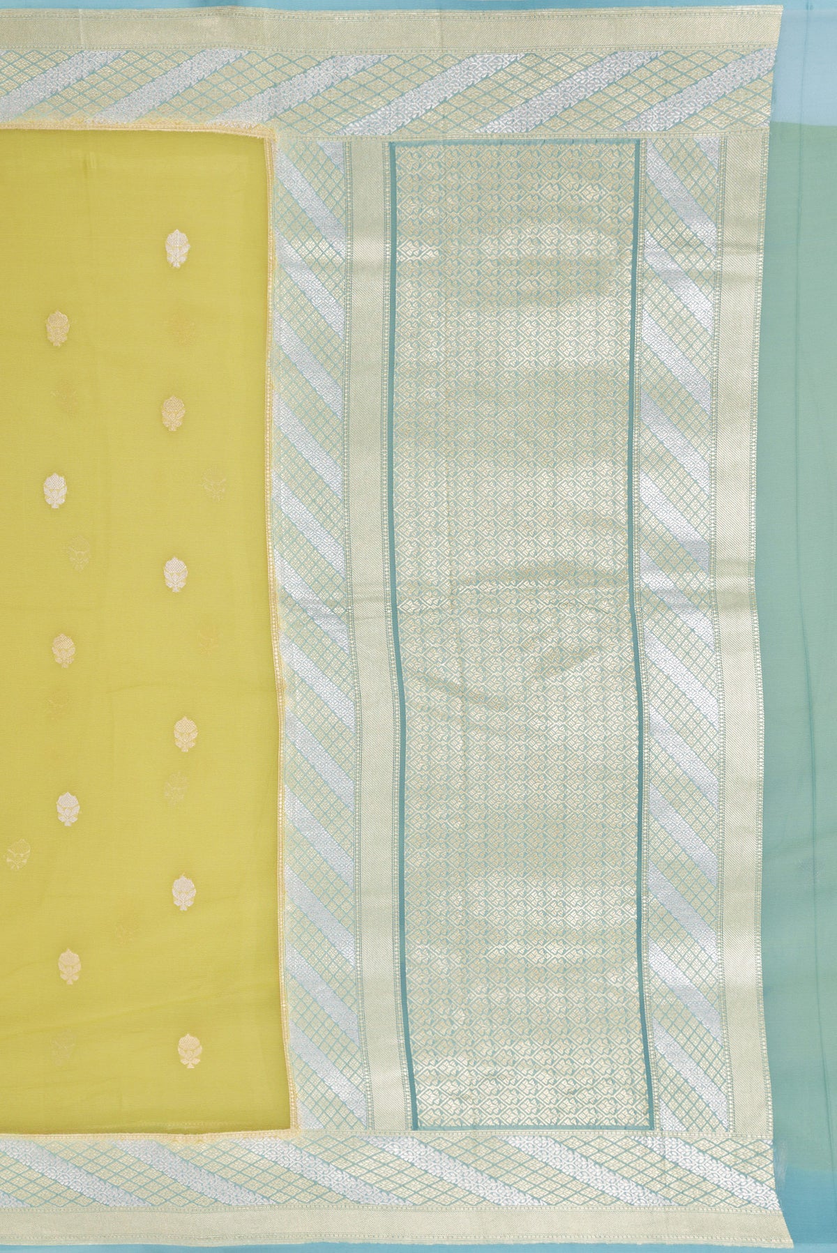 Close up image of the pallu of Pista Green Banarasi Georgette Saree with Zari Butta on the body and Fancy Border. 