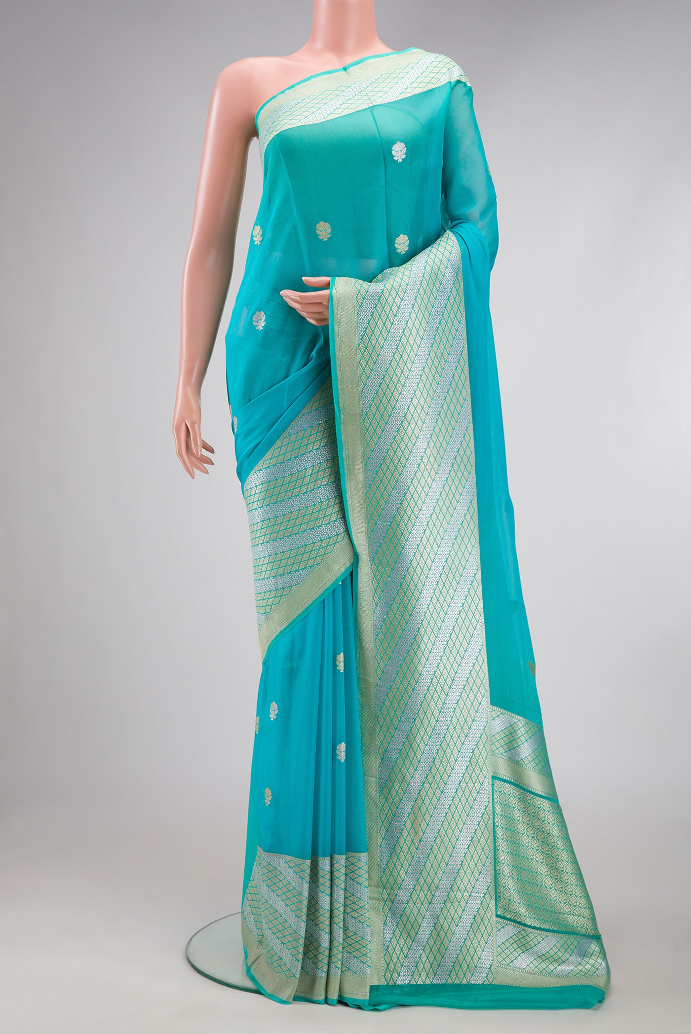 Sky Blue Banarasi Georgette Saree with Zari Butta on the body and Fancy Border.  displayed on a mannequin