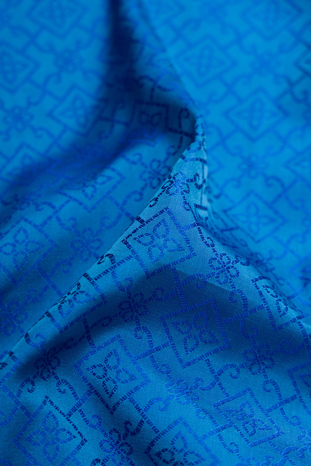Close up of Pure Silk Royal Blue Dual Tone Banarasi Saree with Jacquard design on the body and Fancy Border.  displaying folds