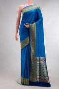 Pure Silk Royal Blue Dual Tone Banarasi Saree with Jacquard design on the body and Fancy Border.  displayed on a mannequin