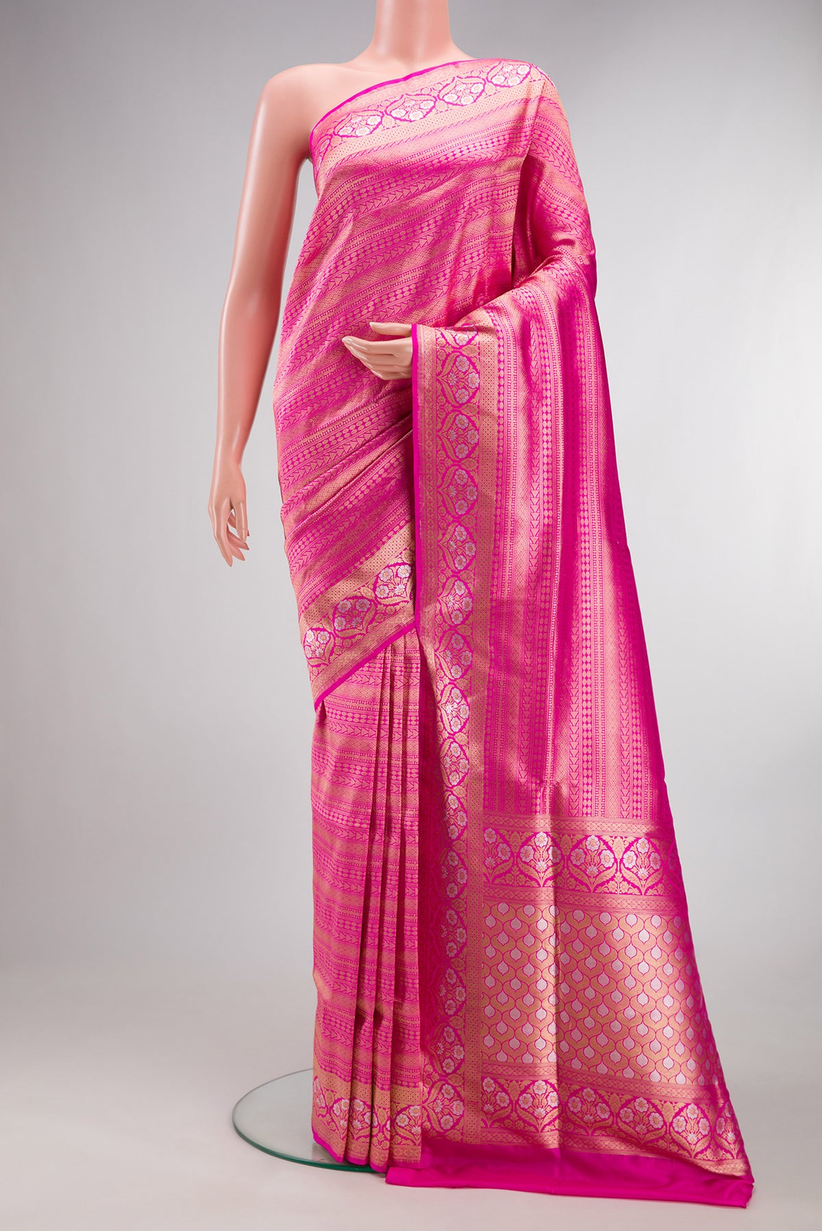 Pure Silk Dark Pink Banarasi Saree with Zari Brocade on the body and Fancy Border.  displayed on a mannequin