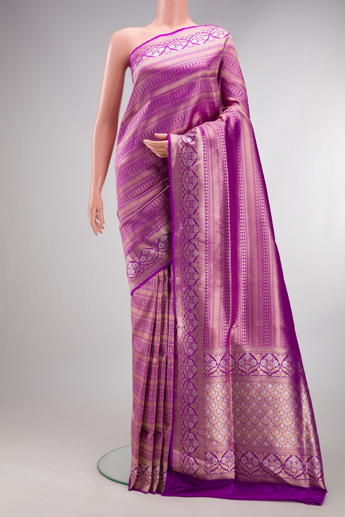 Pure Silk Purple Banarasi Saree with Zari Brocade on the body and Fancy Border.  displayed on a mannequin