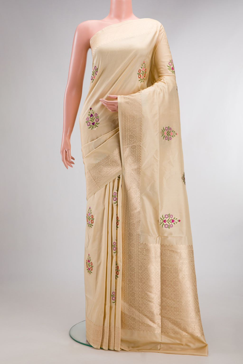 Pure Silk Sandal Banarasi Saree with Zari And Thread Butta on the body and Zari Border.  displayed on a mannequin