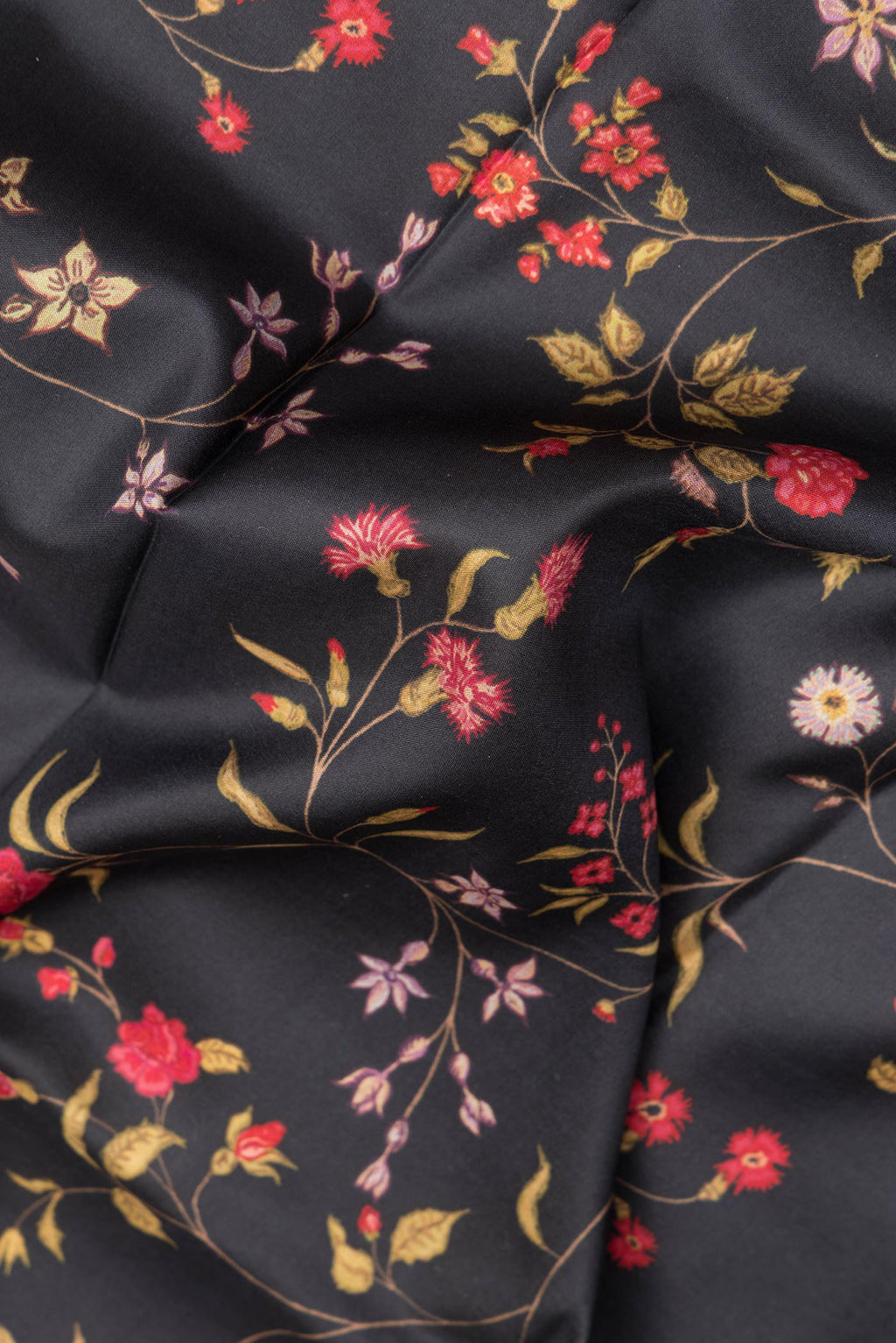Close up of Pure Silk Black Dual Tone Kanchipuram Saree with Printed design on the body and Zari Border.  displaying folds