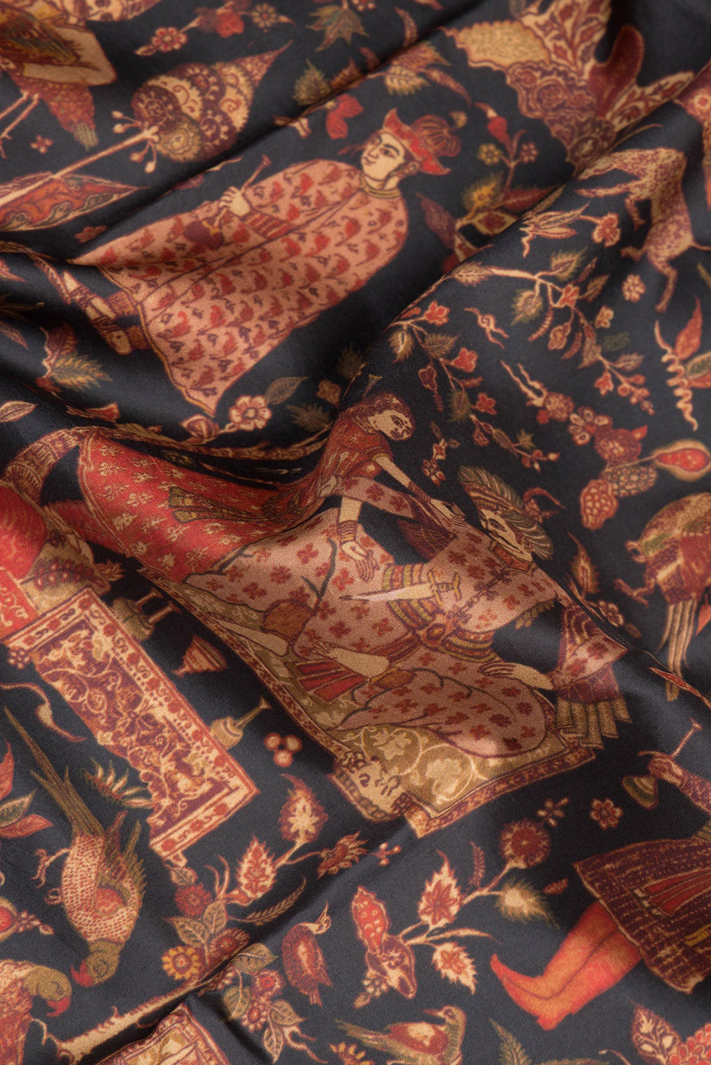 Close up of Pure Silk Black Dual Tone Kanchipuram Saree with Printed design on the body and Zari Border.  displaying folds